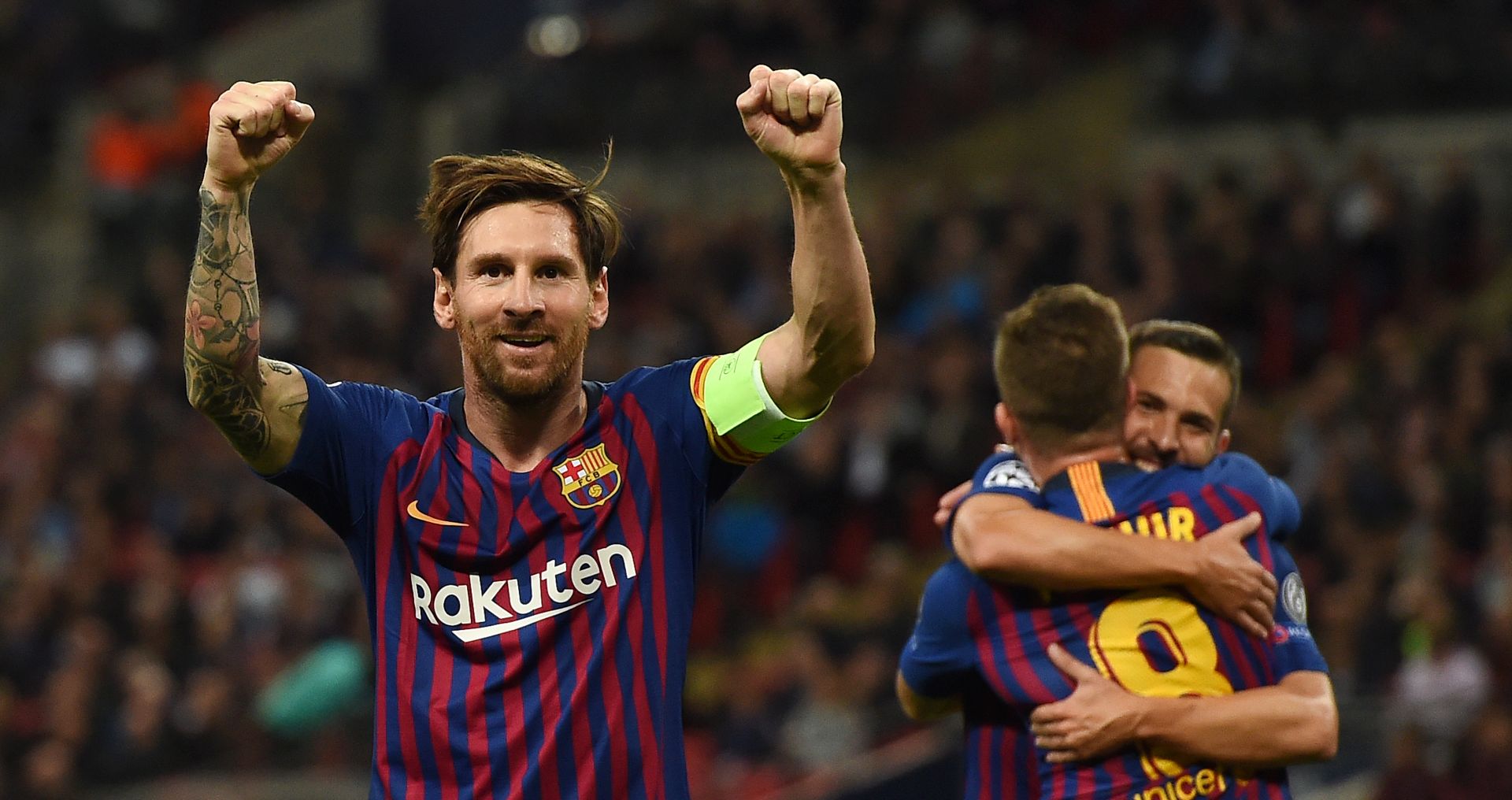 epa07067473 Barcelona's Lionel Messi (L) celebrates after scoring his team's third goal during the UEFA Champions League group B soccer match between Tottenham Hotspur and FC Barcelona, London, Britain, 03 October 2018.  EPA/ANDY RAIN