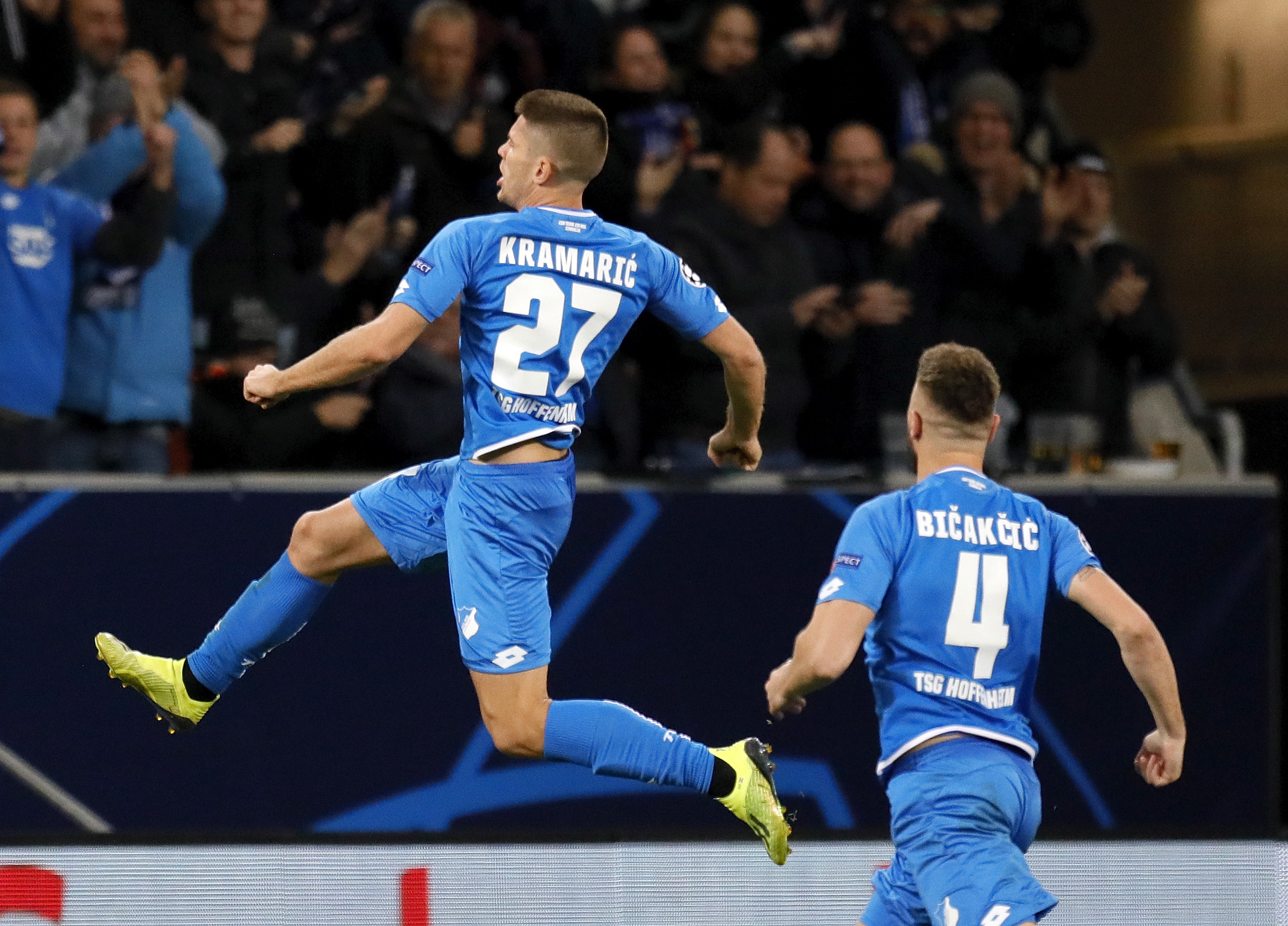 epa07114648 Hoffenheim's Andrej Kramaric (L) celebrates with his teammates after scoring the 2-1 lead during the UEFA Champions League Group F round match between TSG 1899 Hoffenheim and Olympique Lyonnais in Sinsheim, Germany, 23 October 2018.  EPA/RONALD WITTEK