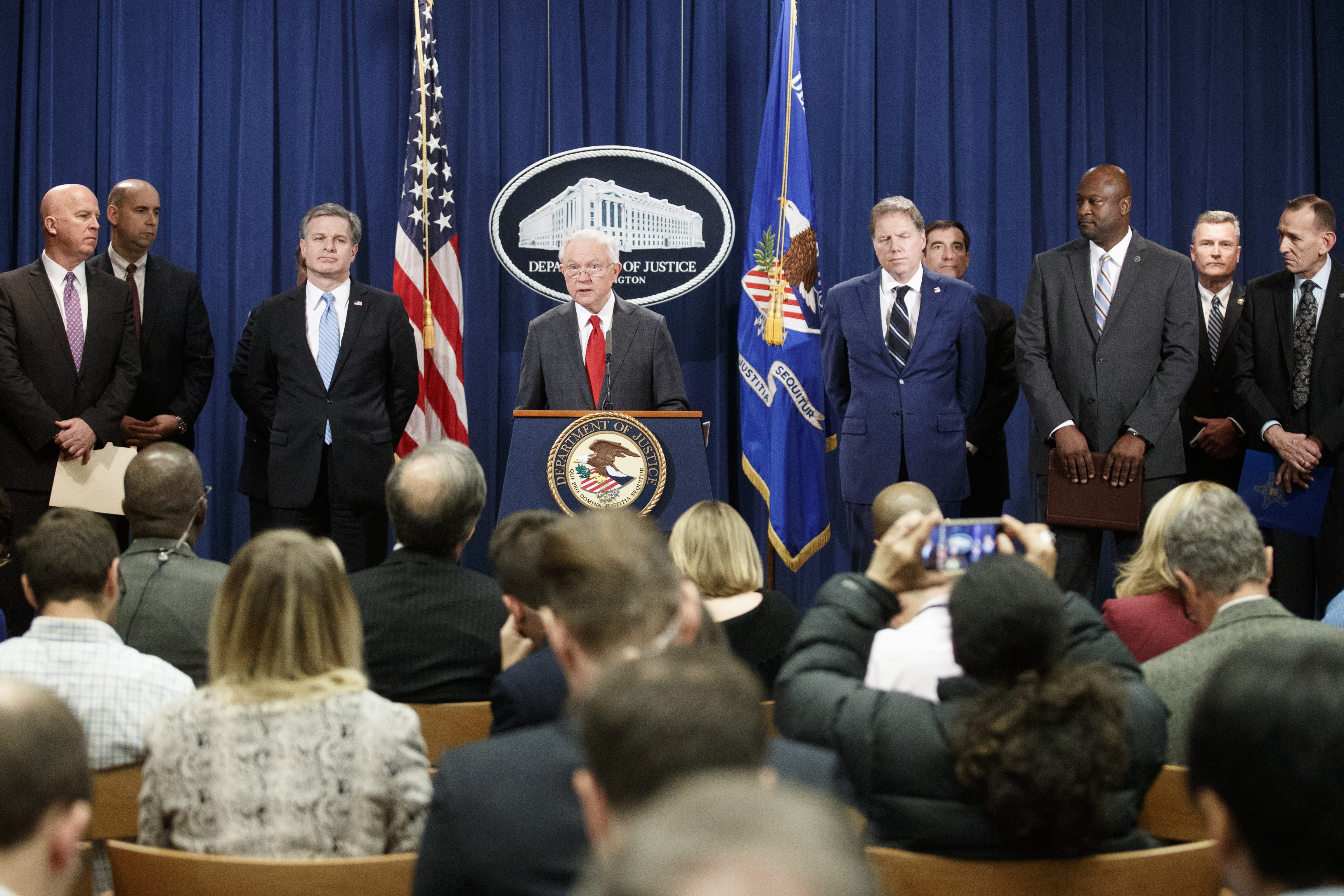 epa07122072 US Attorney General Jeff Sessions (C) delivers remarks on the apprehension and arrest of mail bomb suspect Cesar Sayoc jr. during a press conference at the Department of Justice in Washington, DC, USA, 26 October 2018. Attorney General Sessions was joined FBI Director Chris Wray, New York Police Department Commissioner James P. O'Neill, U.S. Attorney Geoffrey Berman for the Southern District of New York, ATF Deputy Director Thomas E. Brandon, FBI New York Field Office Assistant Director in Charge William F. Sweeney, Jr. and U.S. Postal Inspection Service Deputy Chief Gary Barksdale.  EPA/SHAWN THEW
