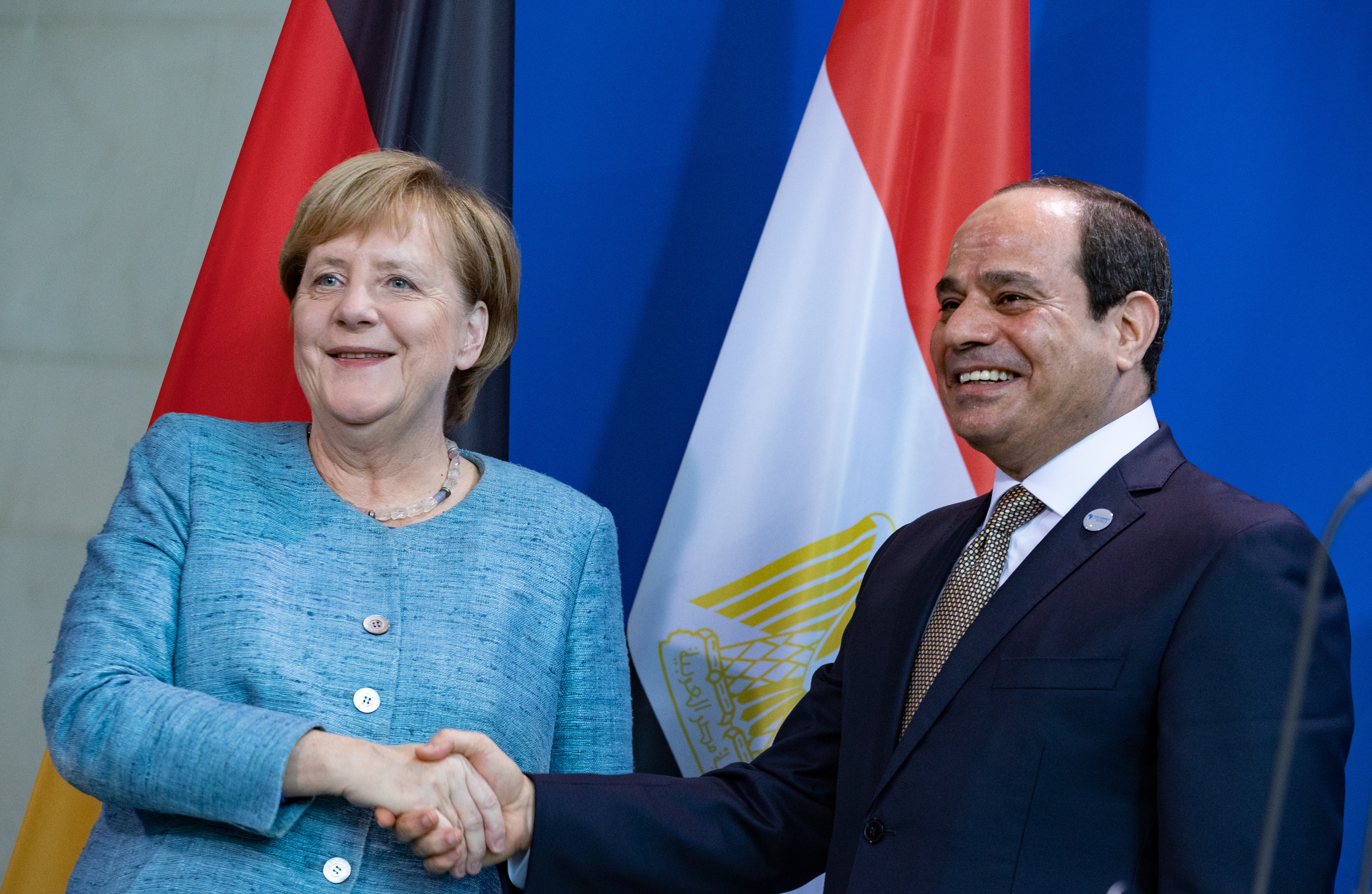 epa07131550 German Chancellor Angela Merkel (L) shakes hands with Egyptian President Abdel Fattah al-Sisi at the chancellery in Berlin, Germany, 30 October 2018. Al-Sisi is in Germany for a four-day visit including a participation in the G20 Compact with Africa summit.  EPA/HAYOUNG JEON