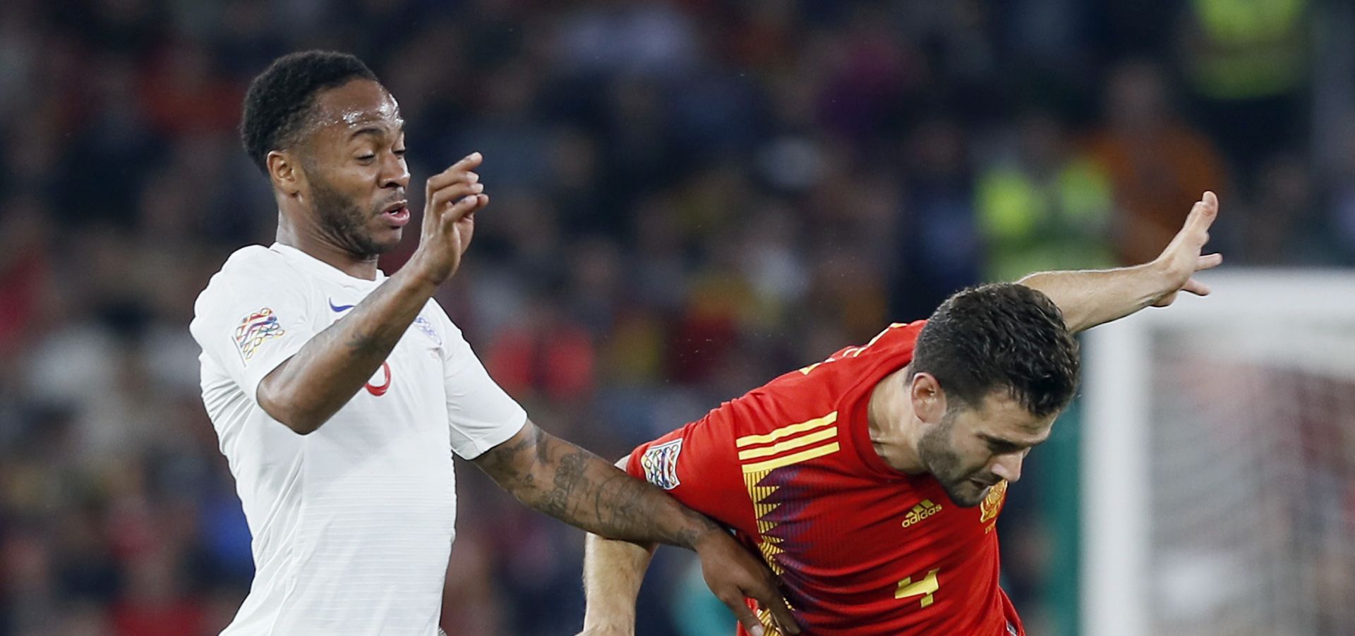 epa07095840 England's Raheem Sterling (L) in action against Spain's Nacho Fernandez (R) during the UEFA Nations League soccer match between Spain and England at Benito Villamarin stadium in Seville, southern Spain, 15 October 2018.  EPA/JOSE MANUEL VIDAL