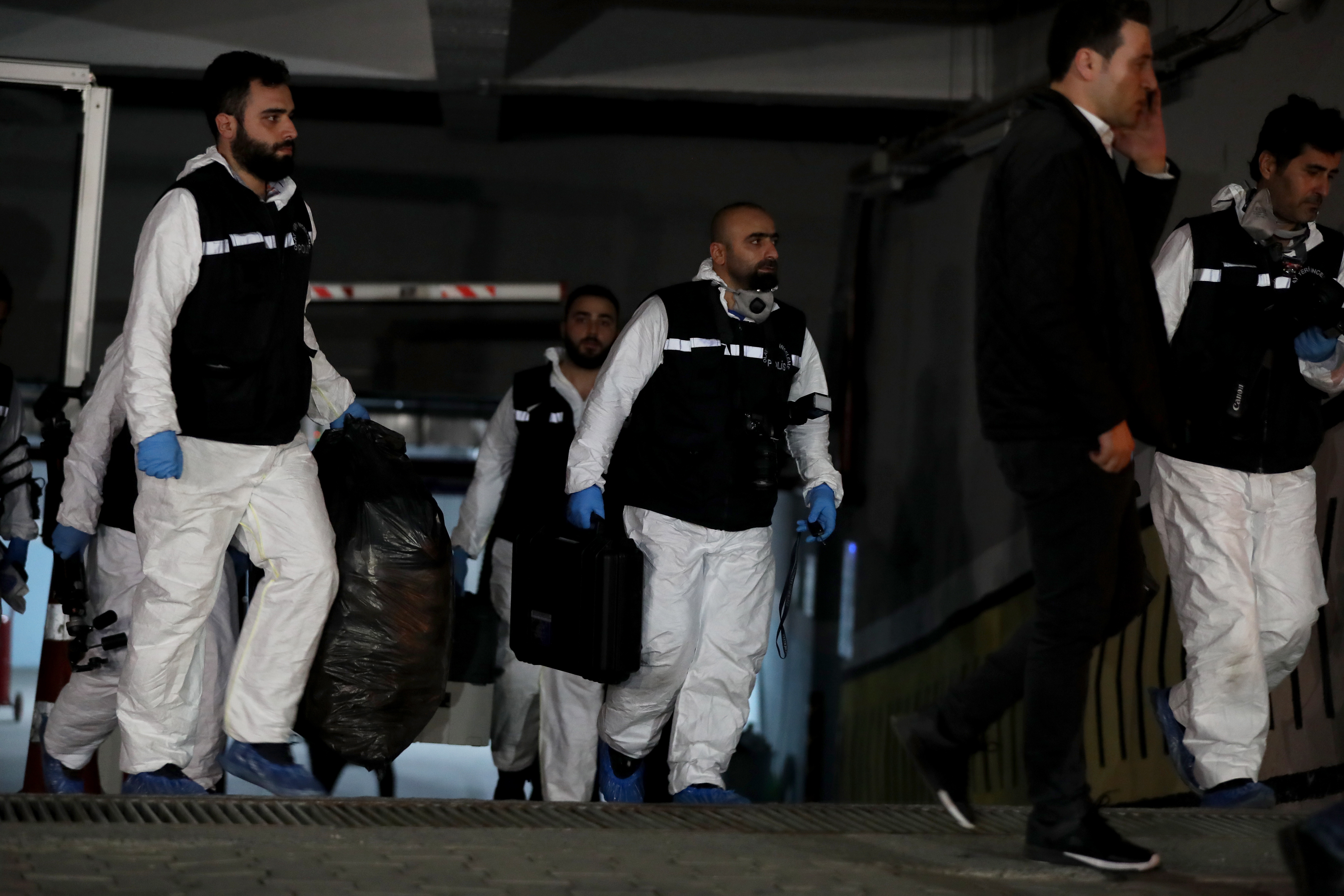 epa07113890 Forensic police officers leave after searching a diplomatic car belonging to the Saudi consulate as part of investigations in the killing of Saudi journalist Jamal Khashoggi in Istanbul, Turkey, 23 October 2018. Reports state Turkish President Recep Tayyip Erdogan said on 23 October that murder of Saudi journalist Jamal Khashoggi at his country's consulate in Istanbul was premeditated and requested the Arab kingdom hand over those responsible to face trial in Turkey. Saudi Arabian official media on 19 October reported that Khashoggi died as a result of a physical altercation inside the kingdom's consulate in Istanbul, where he was last seen entering on 02 October for routine paperwork.  EPA/TOLGA BOZOGLU