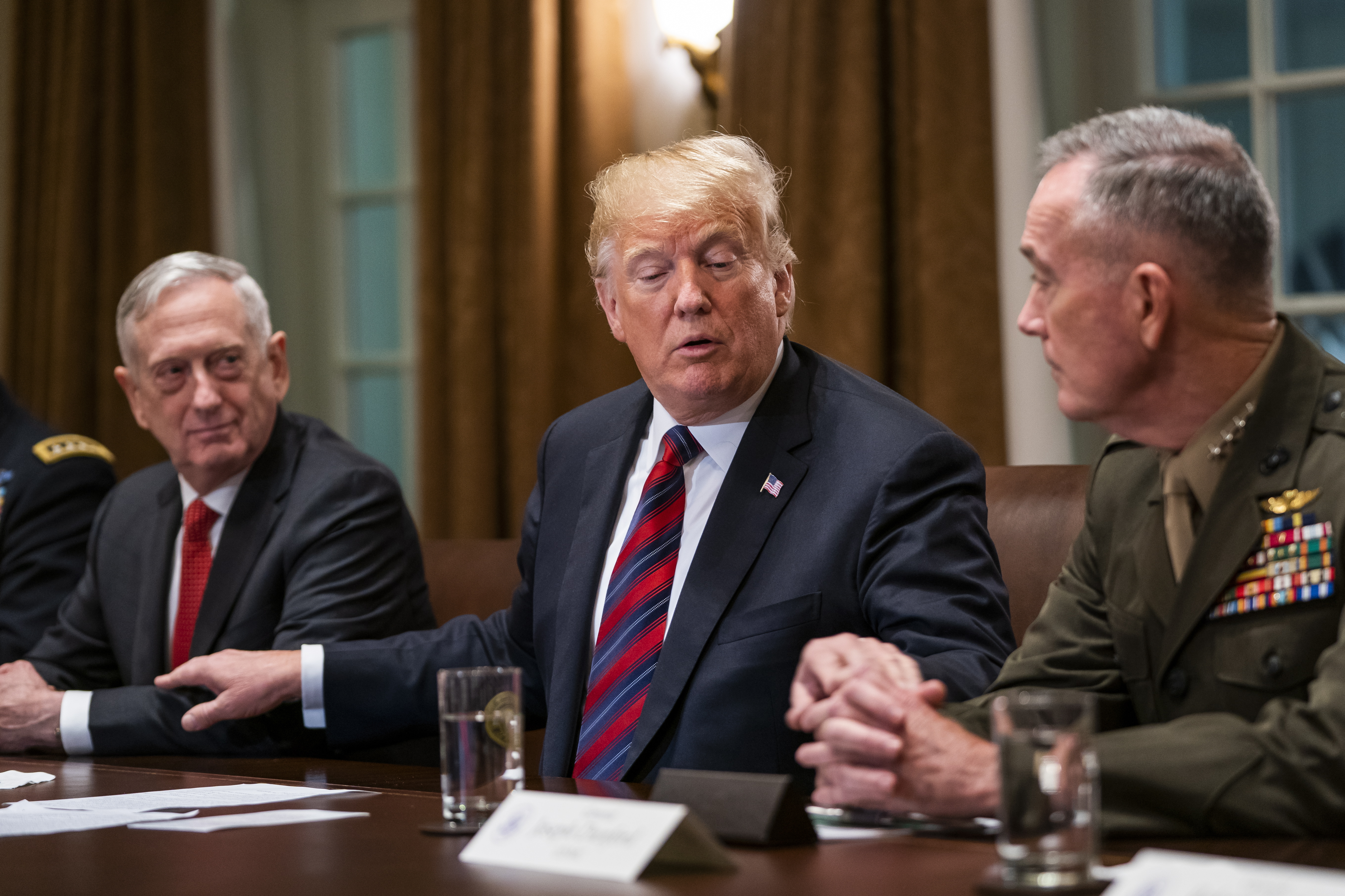 epa07114971 US President Donald J. Trump (C) speaks with Defense Secretary James Mattis (L) and Chairman of the Joint Chiefs of Staff Joseph Dunford (R) during a meeting with senior military advisors in the Cabinet Room of the White House in Washington, DC, USA, 23 October 2018. Trump used the opportunity to speak on the Saudi cover up of the murder of Jamal Khashoggi, as well as the migrant caravan heading to the US.  EPA/JIM LO SCALZO