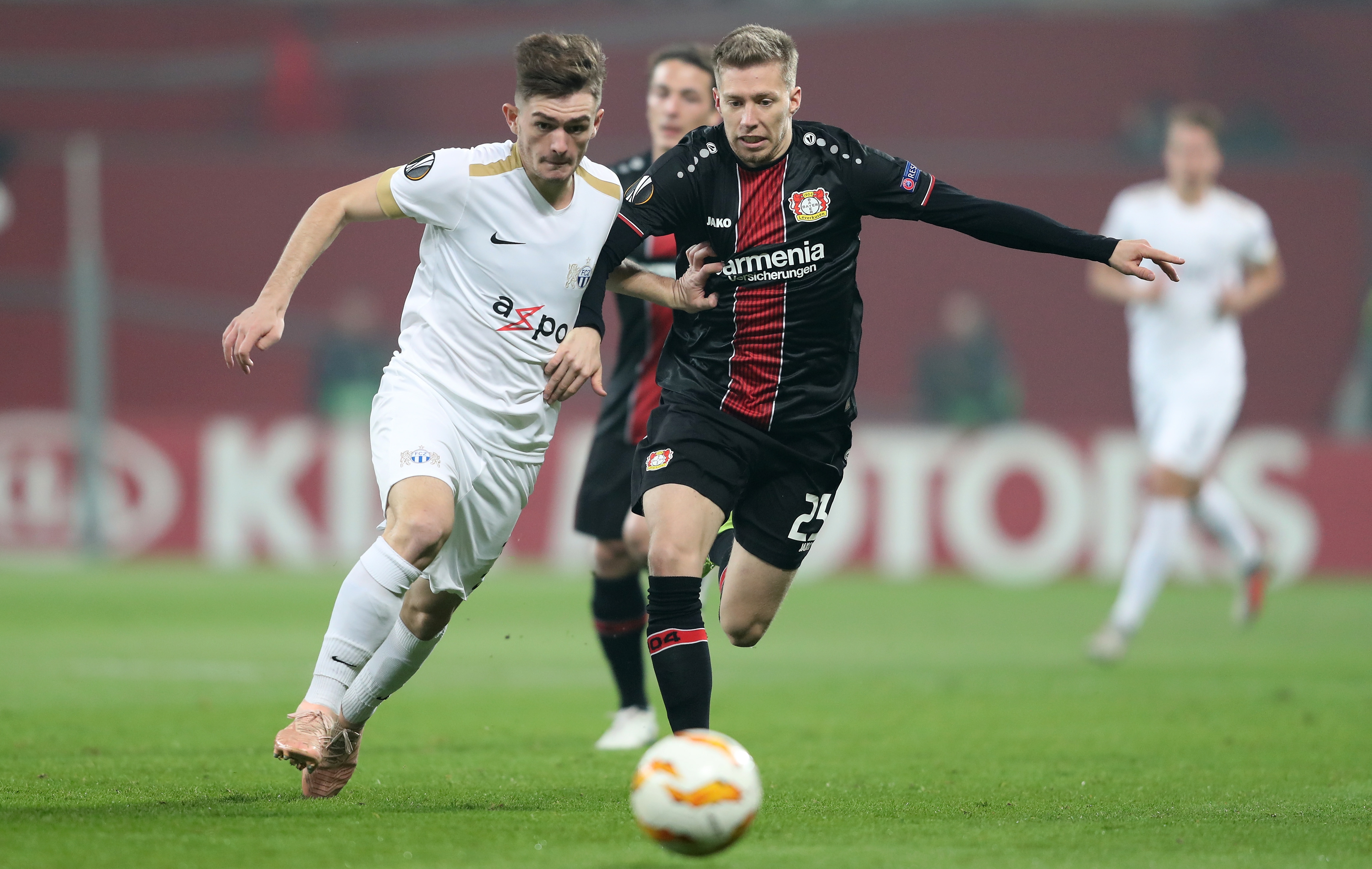 epa07151841 Zuerich's Toni Domgjoni in action with Leverkusen's Mitchell Weiser during the UEFA Europa League Group A soccer match between Bayer Leverkusen and FC Zuerich in Leverkusen, Germany, 08 November 2018.  EPA/FRIEDEMANN VOGEL