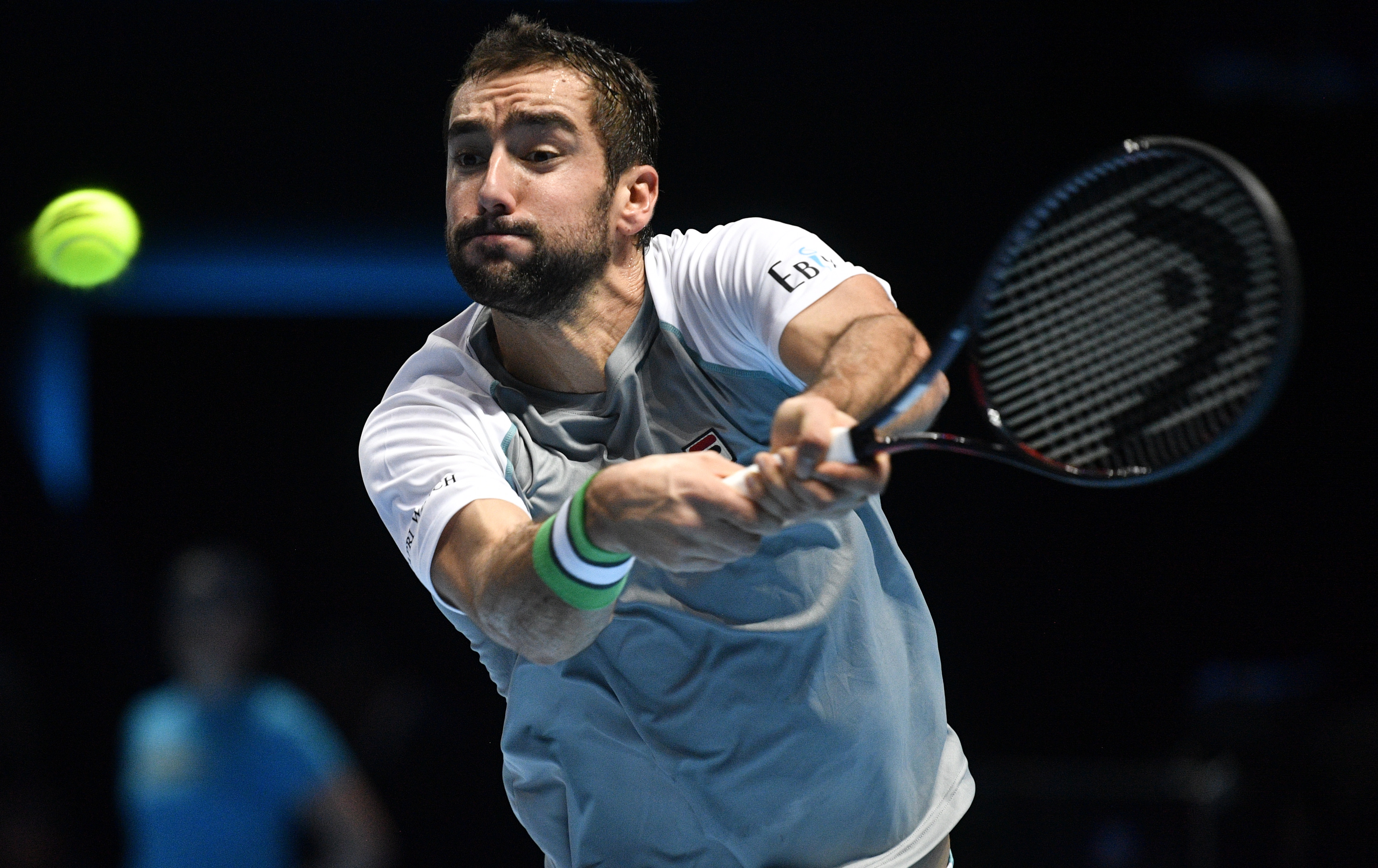 epa07165733 Croatia's Marin Cilic in action during his round-robin match with USA's John Isner on day four of the ATP World Tour Finals tennis tournament at the O2 Arena in London, Britain, 14 November 2018.  EPA/NEIL HALL