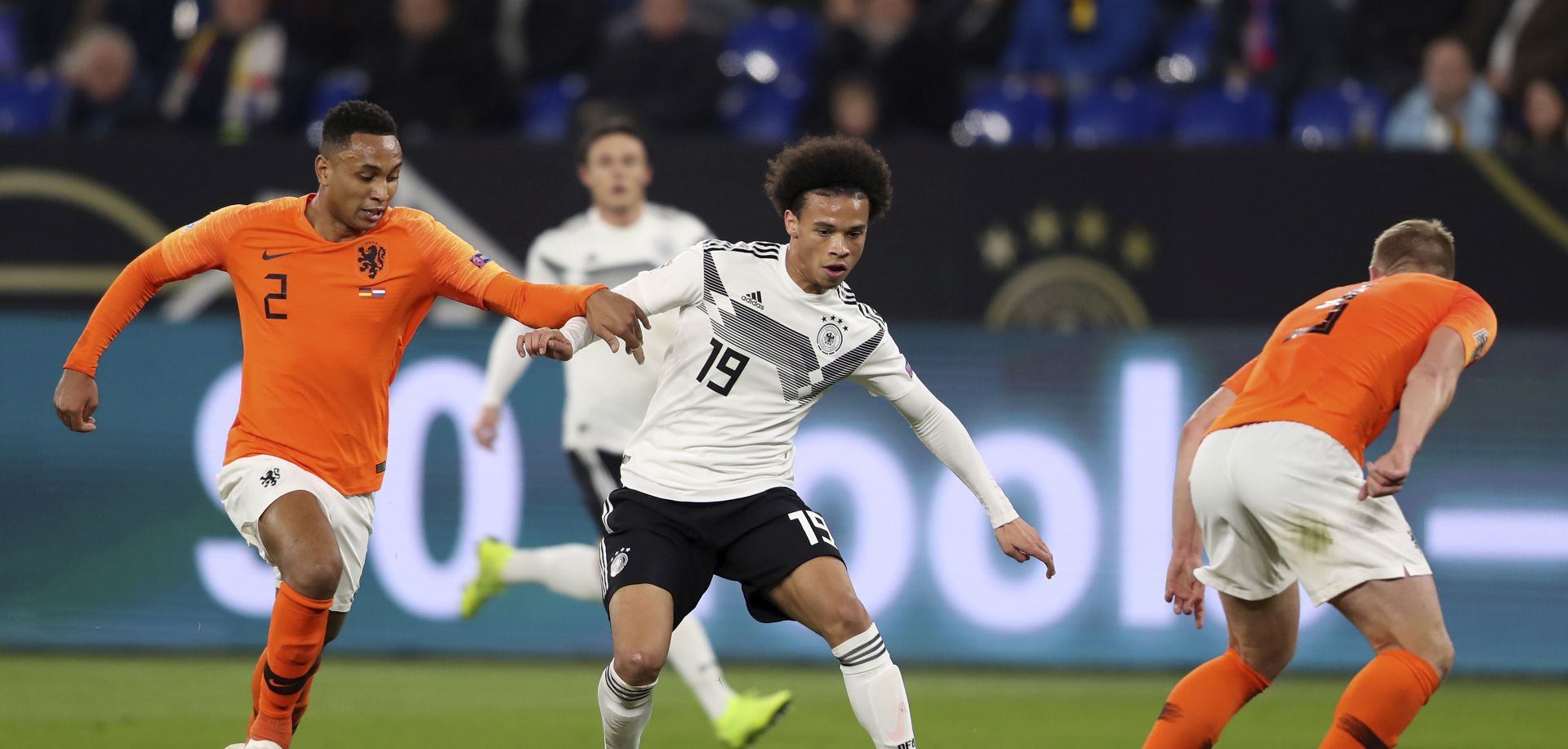 epa07178070 Germany's Leroy Sane (R) in action against Netherland's Kenny Tete (L) during the UEFA Nations League soccer match between Germany and the Netherlands in Gelsenkirchen, Germany, 19 November 2018.  EPA/FRIEDEMANN VOGEL