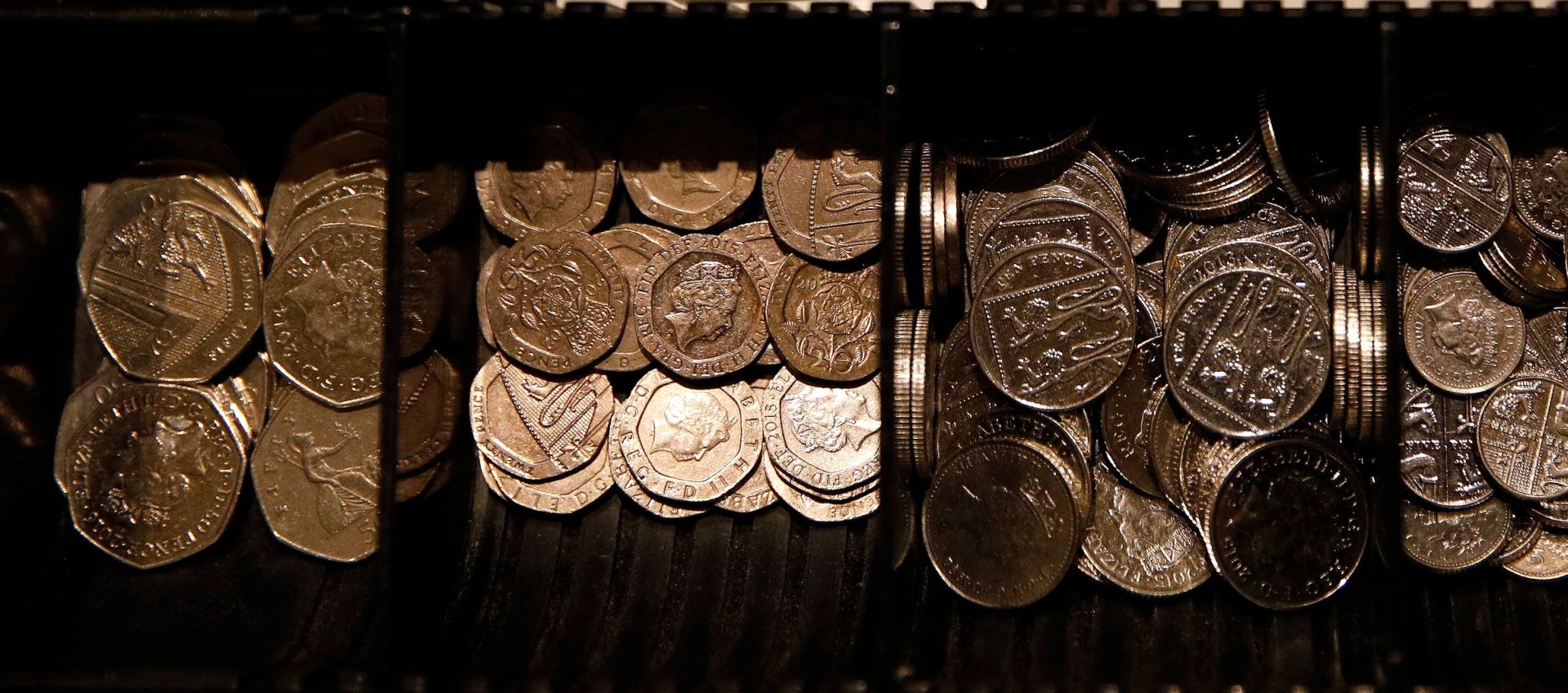 Pound Sterling notes and change are seen inside a cash resgister in a coffee shop in Manchester Pound Sterling notes and change are seen inside a cash resgister in a coffee shop in Manchester, Britain, Septem,ber 21, 2018. REUTERS/Phil Noble PHIL NOBLE
