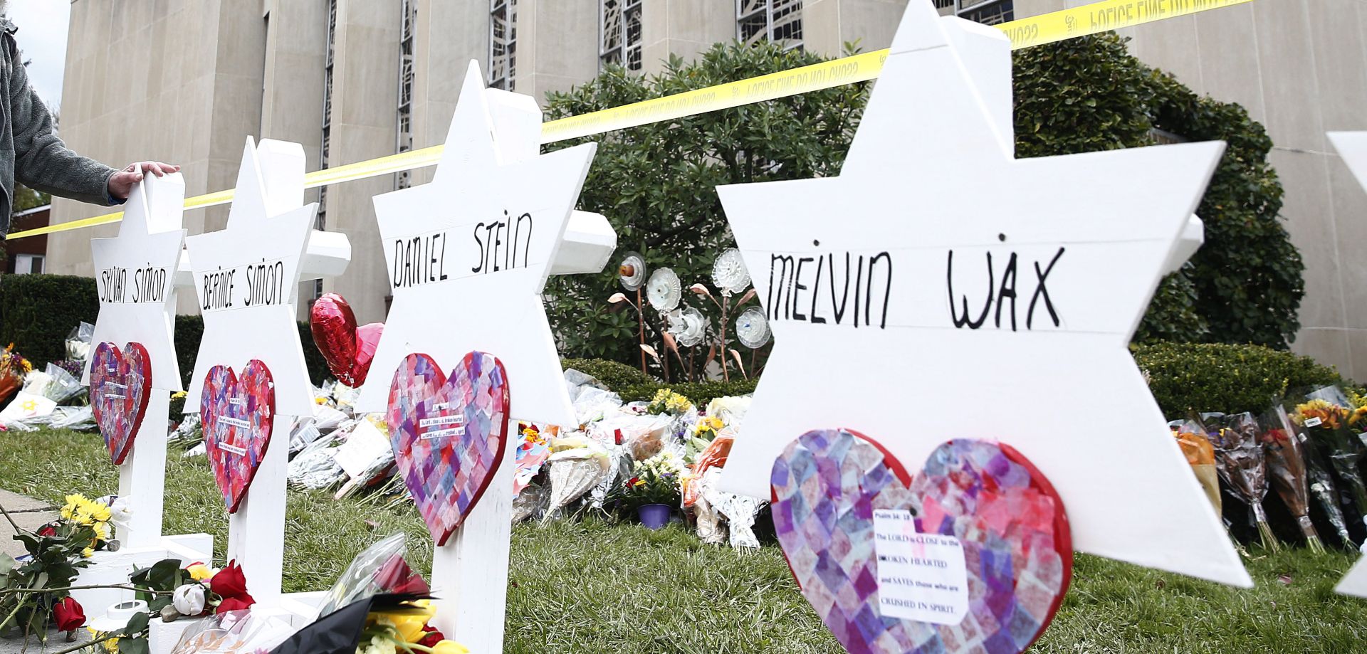 epa07130110 A man takes a moment at each of the Star of David memorials with the names of the 11 people who were killed at the Tree of Life synagogue two days after a mass shooting in Pittsburgh, Pennsylvania, USA, 29 October 2018. Officials report 11 people were killed by the gunman identified as Robert Bowers who has been charged with hate crimes and other federal charges.  EPA/JARED WICKERHAM