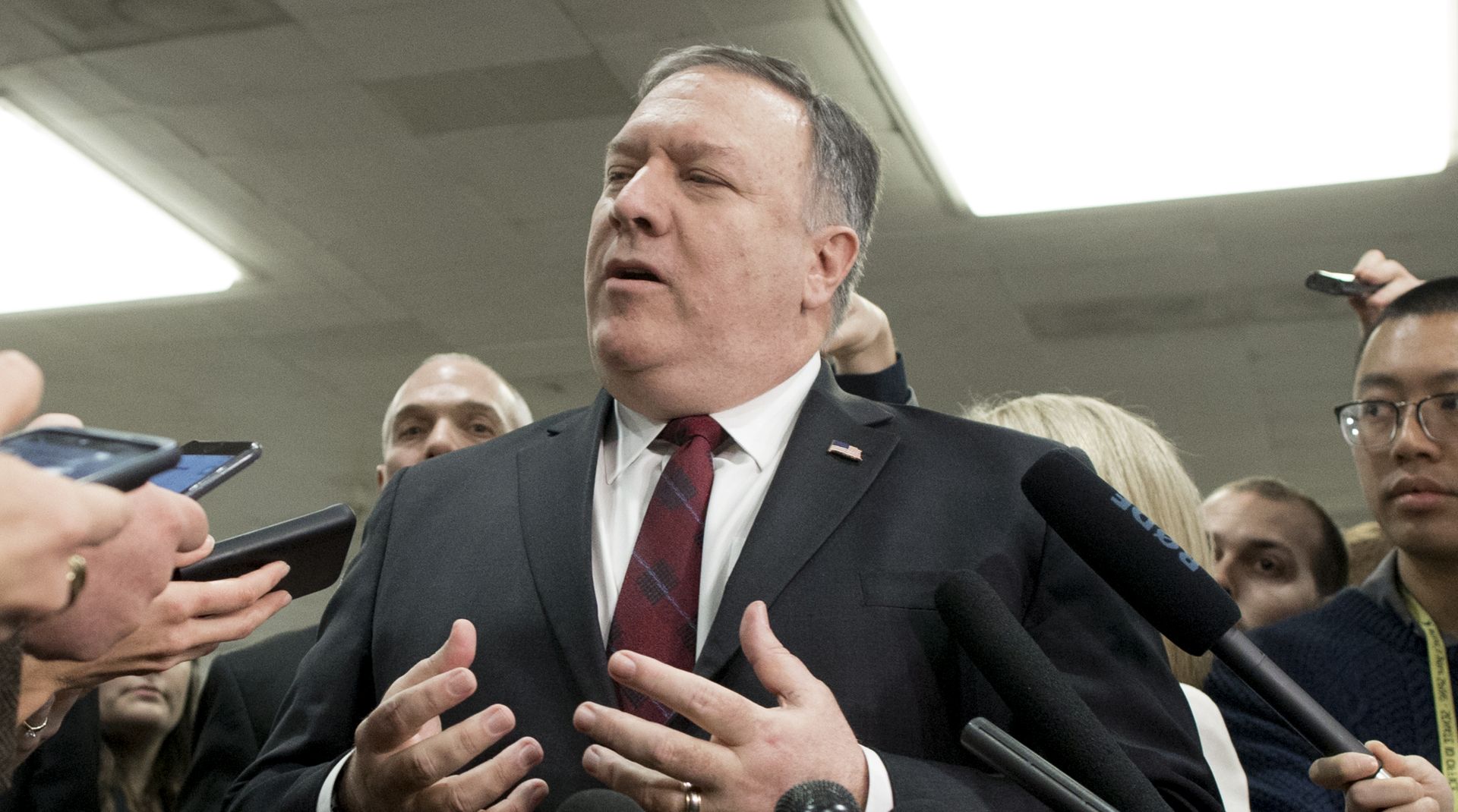 epa07195530 US Secretary of State Mike Pompeo (C) speaks to members of the news media following a closed briefing for US senators on Saudi Arabia, on Capitol Hill in Washington, DC, USA, 28 November 2018. Members of the US Senate attended a briefing by US Secretary of State Mike Pompeo and US Secretary of Defense Jim Mattis on developments relating to Saudi Arabia. The Senate is expected to consider a resolution co-sponsored by Independent Senator from Vermont Bernie Sanders and Republican Senator from Utah Mike Lee that would stop US support of Saudi Arabia's involvement in conflict in Yemen following the death of Washington Post contributor Jamal Khashoggi.  EPA/MICHAEL REYNOLDS
