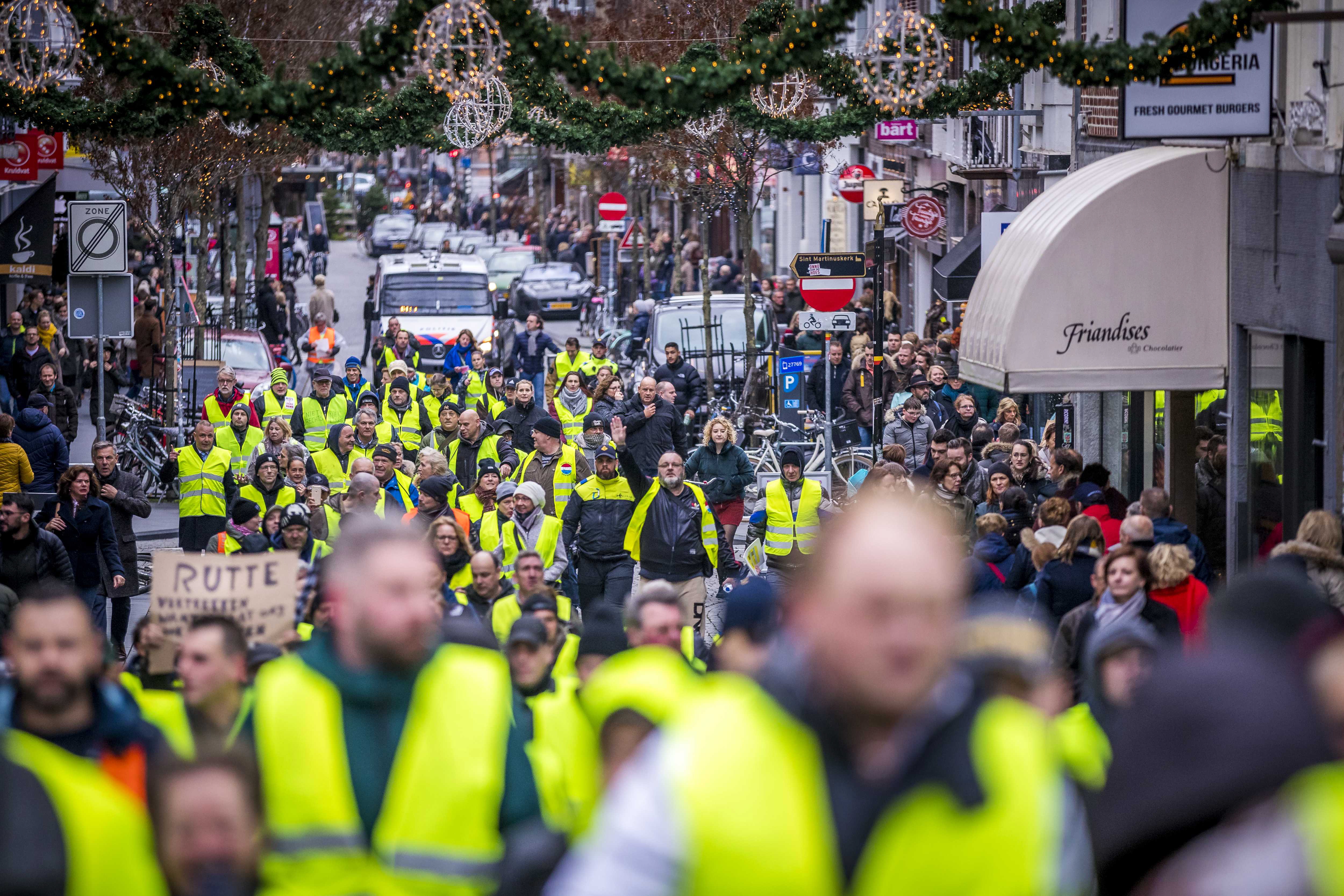 epa07217254 Protestors wearing yellow vests demonstrate in Maastricht in the south of The Netherlands, 08 December 2018. The so-called gilets jaunes (yellow vests) protest movement, which started in France, is protesting over rising fuel prices and taxes.  EPA/MARCEL VAN HOORN