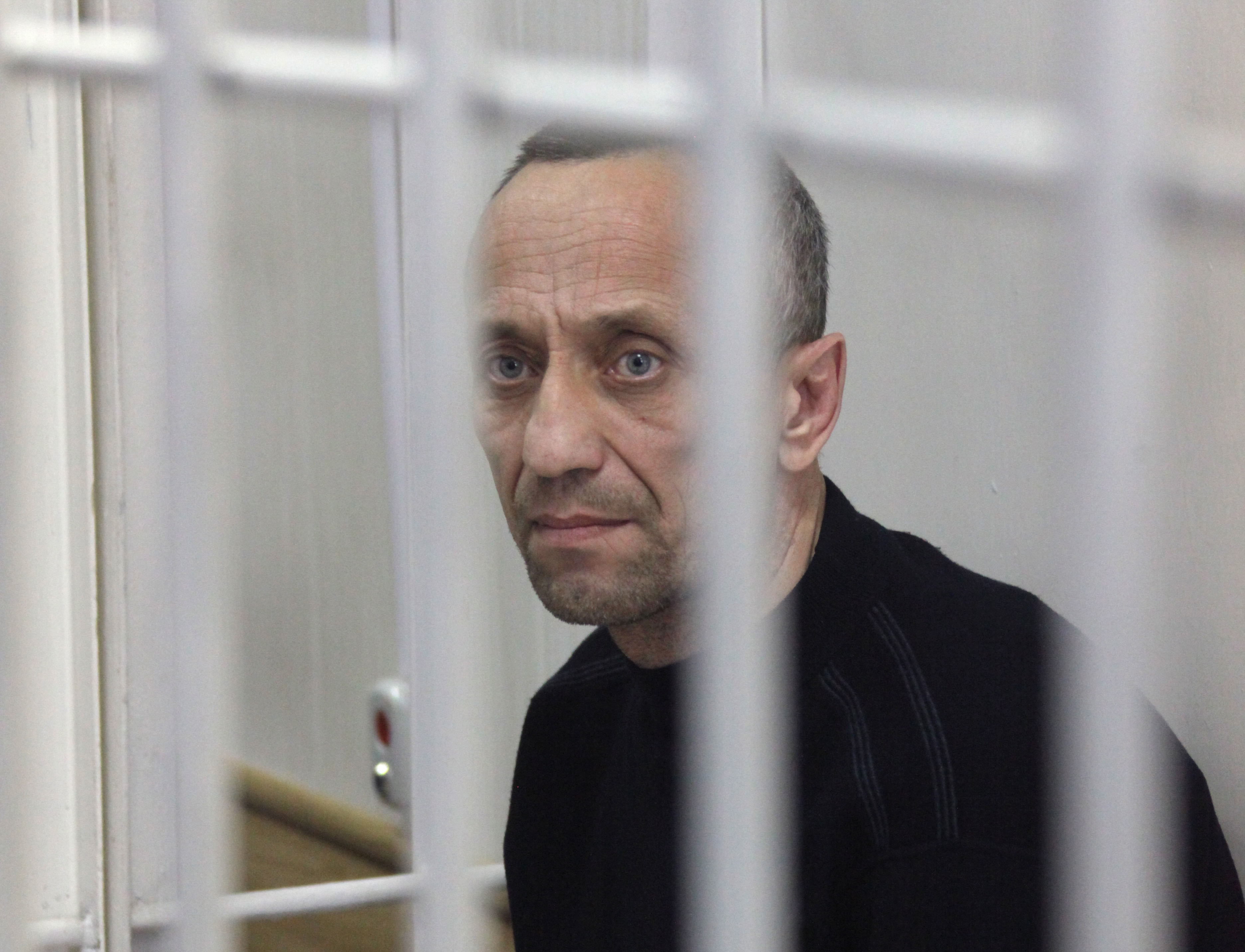 epa07221375 (FILE) - Former police officer Mikhail Popkov during a verdict announcement at the Irkutsk Regional Court in the city of Irkutsk, eastern Siberia, Russia, 14 January 2015 (reissued 10 December 2018). The convicted rapist and serial killer Mikhail Popkov, who was sentenced to life for killing 22 women during a six-year period from 1994 to 2000, was given an additional life sentence 10 December 2018   for 56 additional killings.  EPA/DMITRY DMITRIYEV