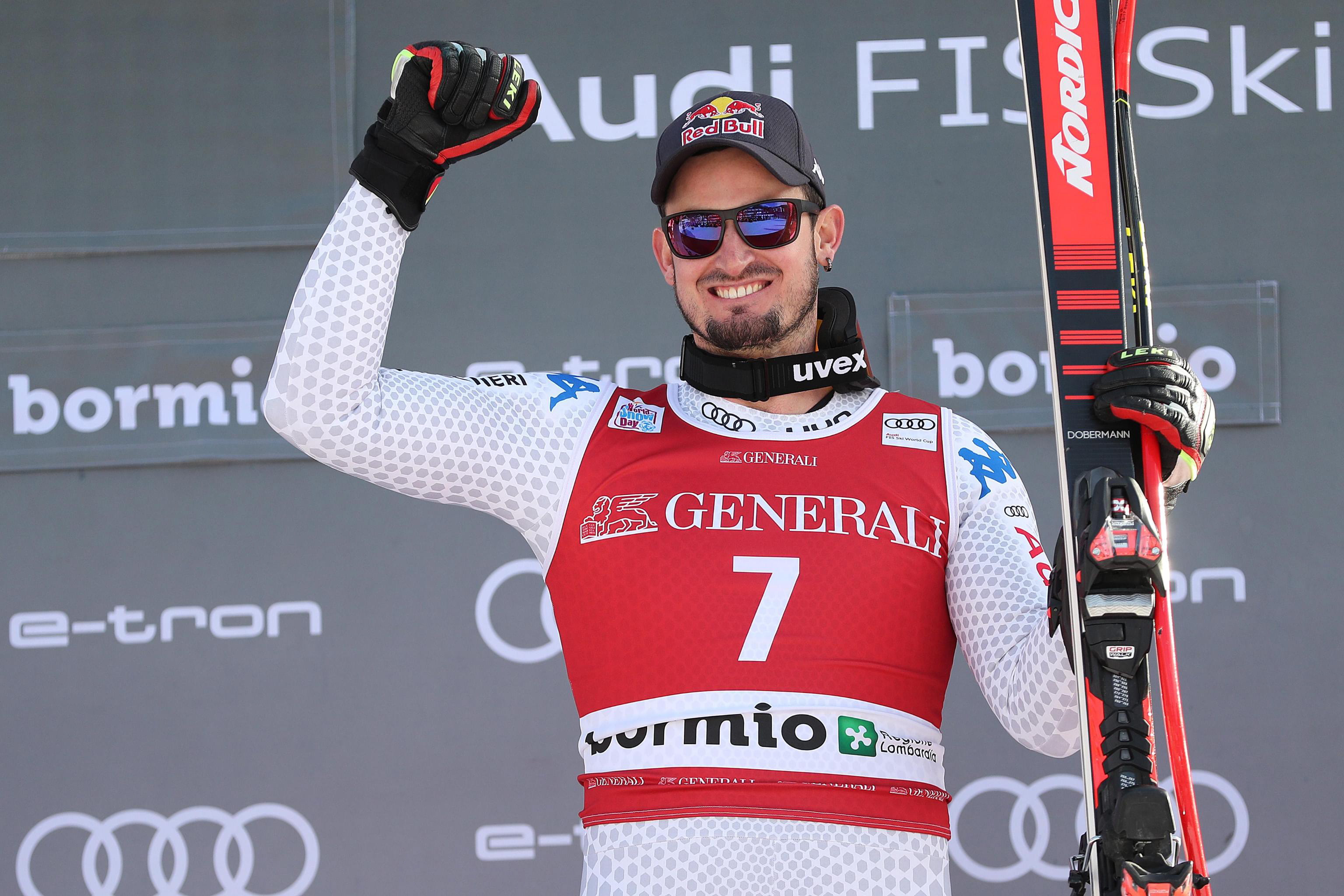epa07251505 Winner Dominik Paris of Italy celebrates on the podium after the Men's Downhill race at the FIS Alpine Skiing World Cup event in Bormio, Italy, 28 December 2018.  EPA/ANDREA SOLERO