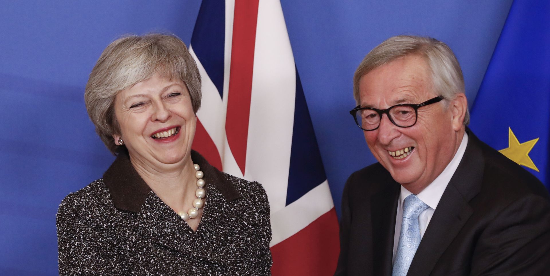 epa07224226 British Prime Minister Theresa May (L) and European commission President Jean-Claude Juncker (R) prior to a meeting in Brussels, Belgium, 11 December 2018. British Prime Minister Theresa May postponed the Brexit deal Meaningful Vote, on 11 December 2018 due to risk of rejection from Members of Parliament. Theresa May is currently on a whistle stop tour of Europe calling on the leaders of the Netherlands, Germany and EU in Brussels looking for new guidelines for her Northern Ireland backstop.  EPA/OLIVIER HOSLET