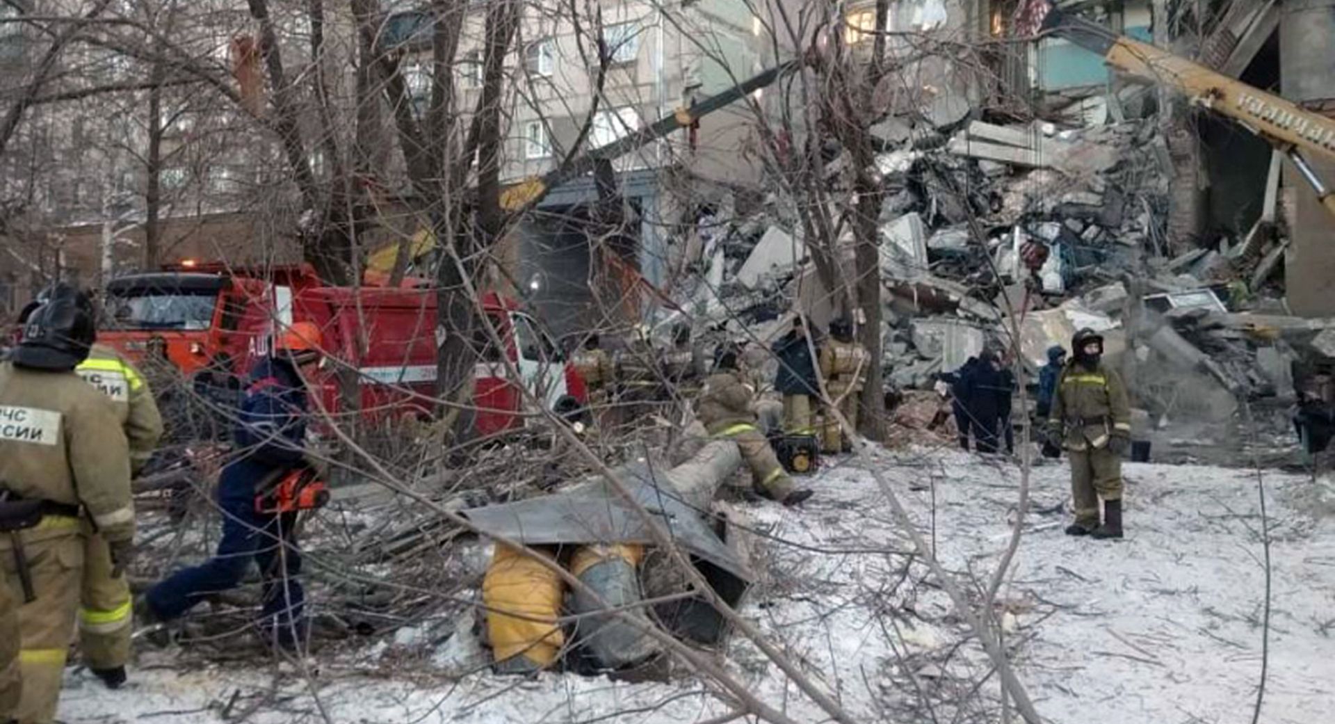 epa07255004 A handout photo made available by the Russian Ministry of Emergency Situations (EMERCOM) shows Russian rescue workers removing debris after a gas explosion in an apartment building in the city of Magnitogorsk, Chelyabinsk region, Russia, 31 December 2018. The explosion in a residential building in Magnitogorsk damaged 48 apartments, where 110 people lived. Six people were removed from the rubble: at least four died, two were injured, including one child. The fate of 68 residents is still unknown.  EPA/RUSSIAN EMERGENCY SITUATIONS MINISTRY HANDOUT -- BEST QUALITY AVAILABLE -- HANDOUT EDITORIAL USE ONLY/NO SALES