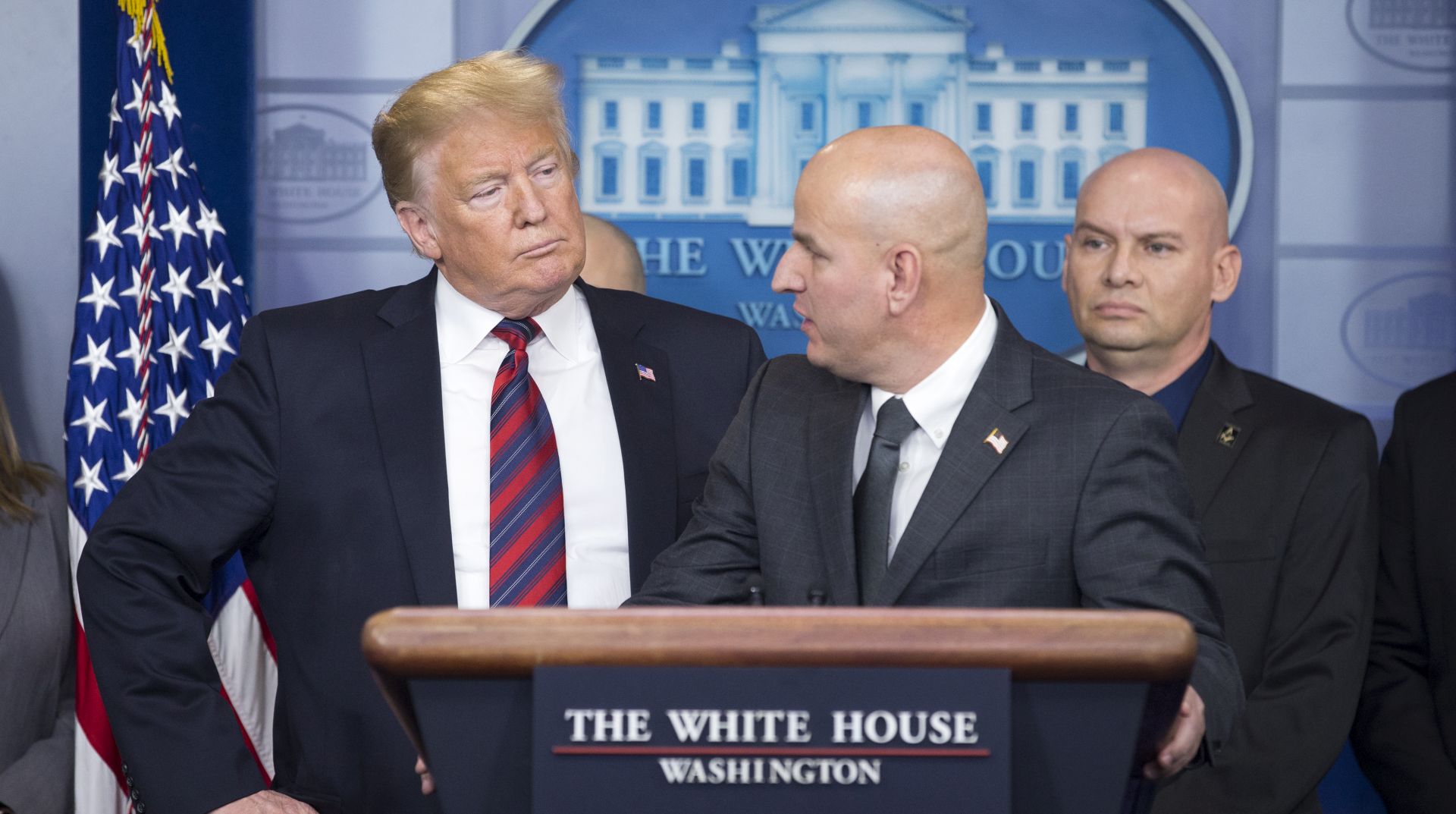 epa07260652 US President Donald J. Trump (L) listens to National Border Patrol Council (NBPC) President Brandon Judd (C) deliver a statement on border security with members of the NBPC, in the James Brady Press Briefing Room of the White House in Washington, DC, USA, 03 January 2019. A partial shutdown of the government began when Congress and Trump failed to strike a deal before a 22 December 2018 deadine, due to differences regarding border security.  EPA/MICHAEL REYNOLDS