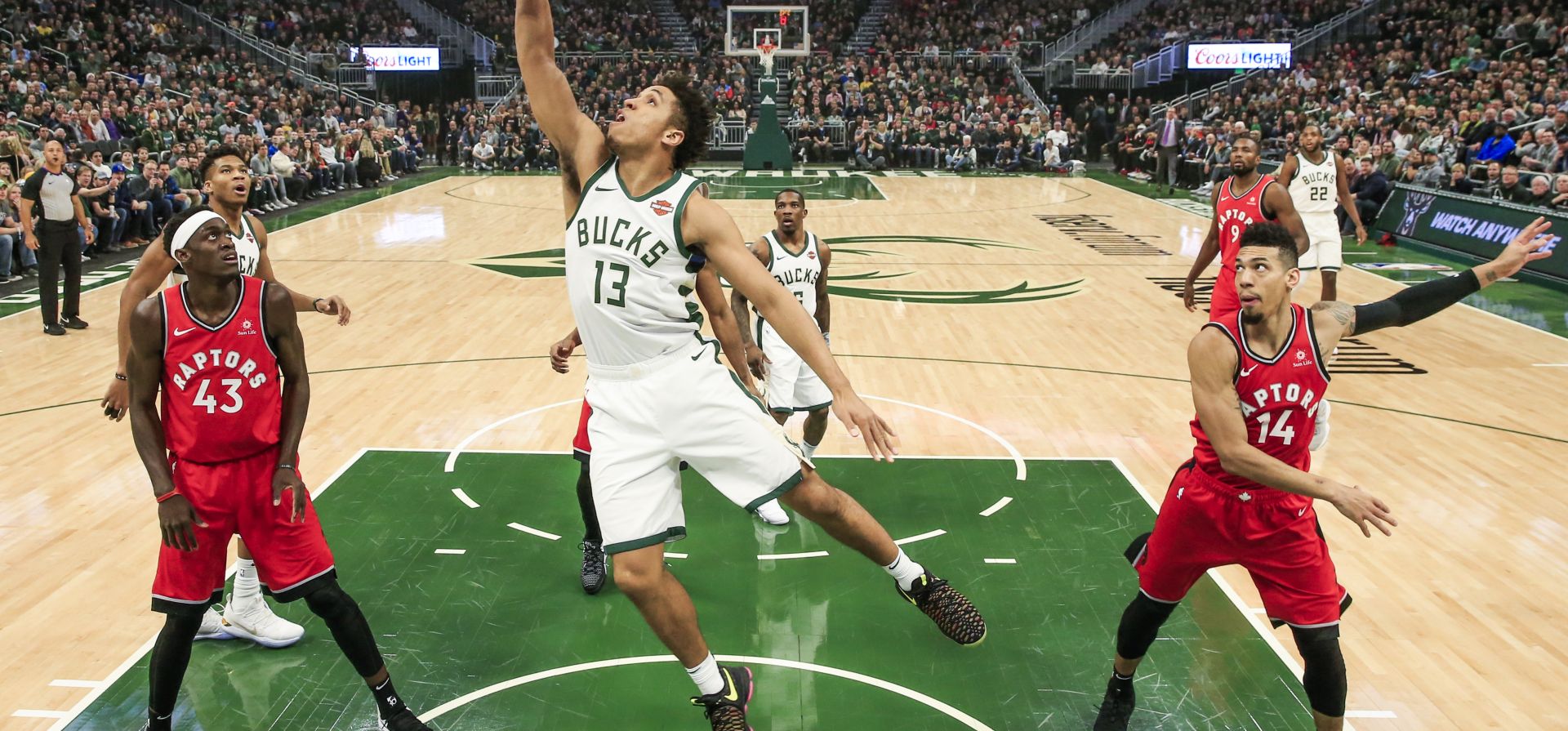 epa07264256 Toronto Raptors guard Danny Green (R) and Toronto Raptors forward Pascal Siakam of Cameroon (L) watch as Milwaukee Bucks guard Malcolm Brogdon (C) scores during the NBA game between the Toronto Raptors and the Milwaukee Bucks at Fiserv Forum in Milwaukee, Wisconsin, USA, 05 January 2019.  EPA/TANNEN MAURY SHUTTERSTOCK OUT