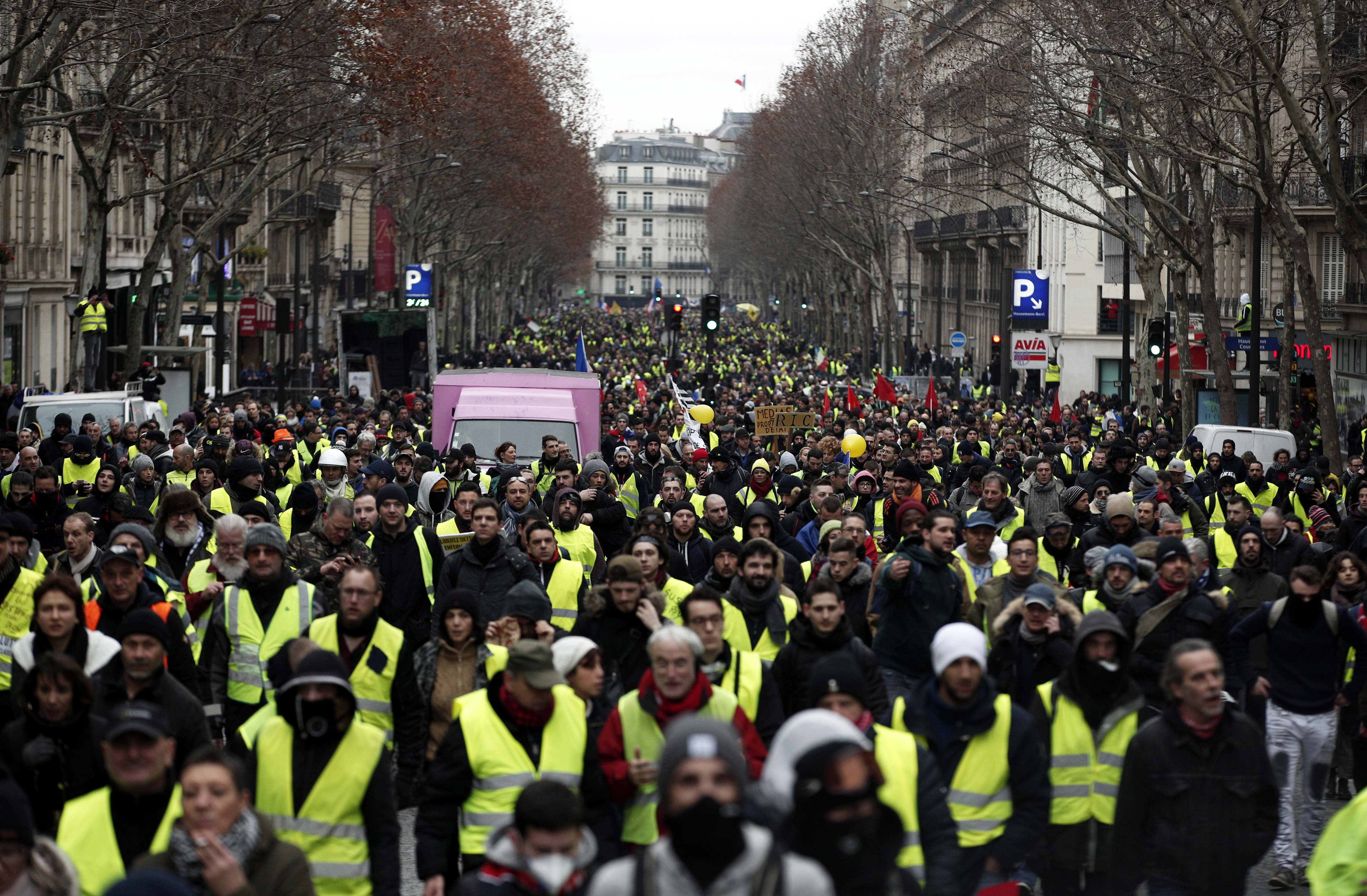 epa07277484 Protesters from the 'Gilets Jaunes' (Yellow Vests) movement take part in the 'Act IX' demonstration (the 9th consecutive national protest on a Saturday) in Paris, France, 12 January 2019. The so-called 'gilets jaunes' (yellow vests) is a grassroots protest movement with supporters from a wide span of the political spectrum, that originally started with protest across the nation in late 2018 against high fuel prices. The movement in the meantime also protests the French government's tax reforms, the increasing costs of living and some even call for the resignation of French President Emmanuel Macron.  EPA/YOAN VALAT