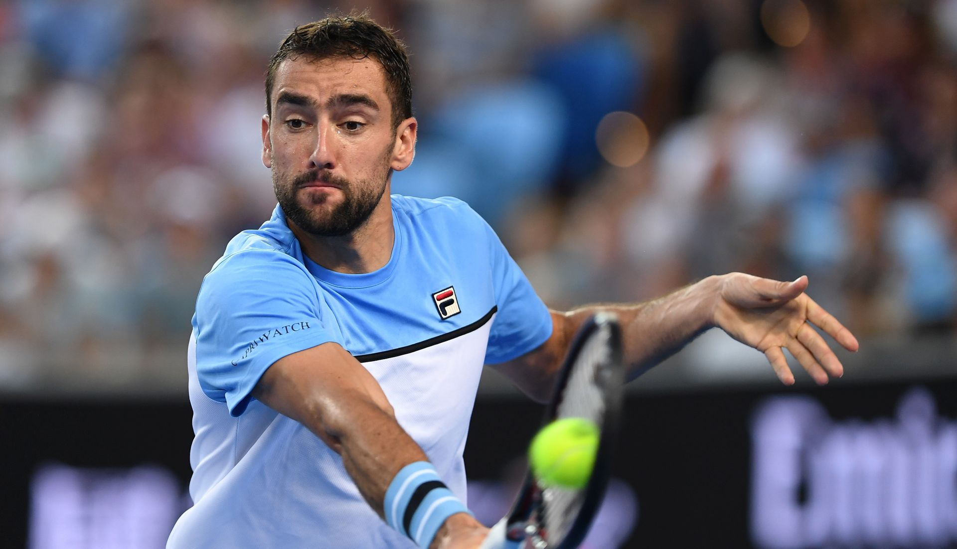 epa07282437 Marin Cilic of Croatia in action during his men's singles first round against Bernard Tomic of Australia at the Australian Open tennis tournament in Melbourne, Australia, 14 January 2019.  EPA/LUKAS COCH AUSTRALIA AND NEW ZEALAND OUT