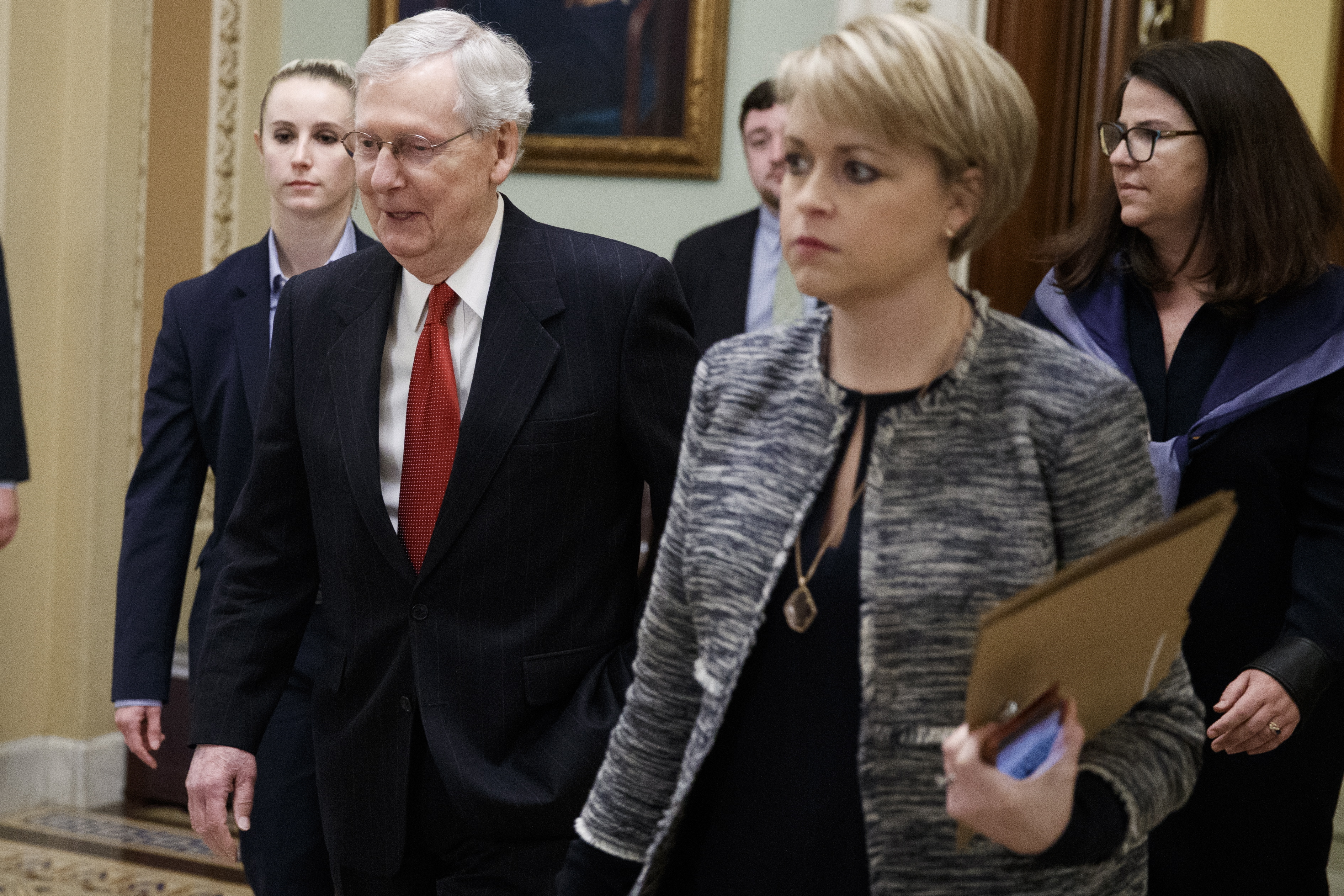 epa07316792 Senate Majority Leader Mitch McConnell (2-L) walks off the Senate Floor after a pair of votes to reopen the government in the US Capitol in Washington, DC, USA, 24 January 2019. The Senate defeated 2 bills, one Republican and one Democratic, to reopen the government now in its 34th day of a partial shutdown.  EPA/SHAWN THEW