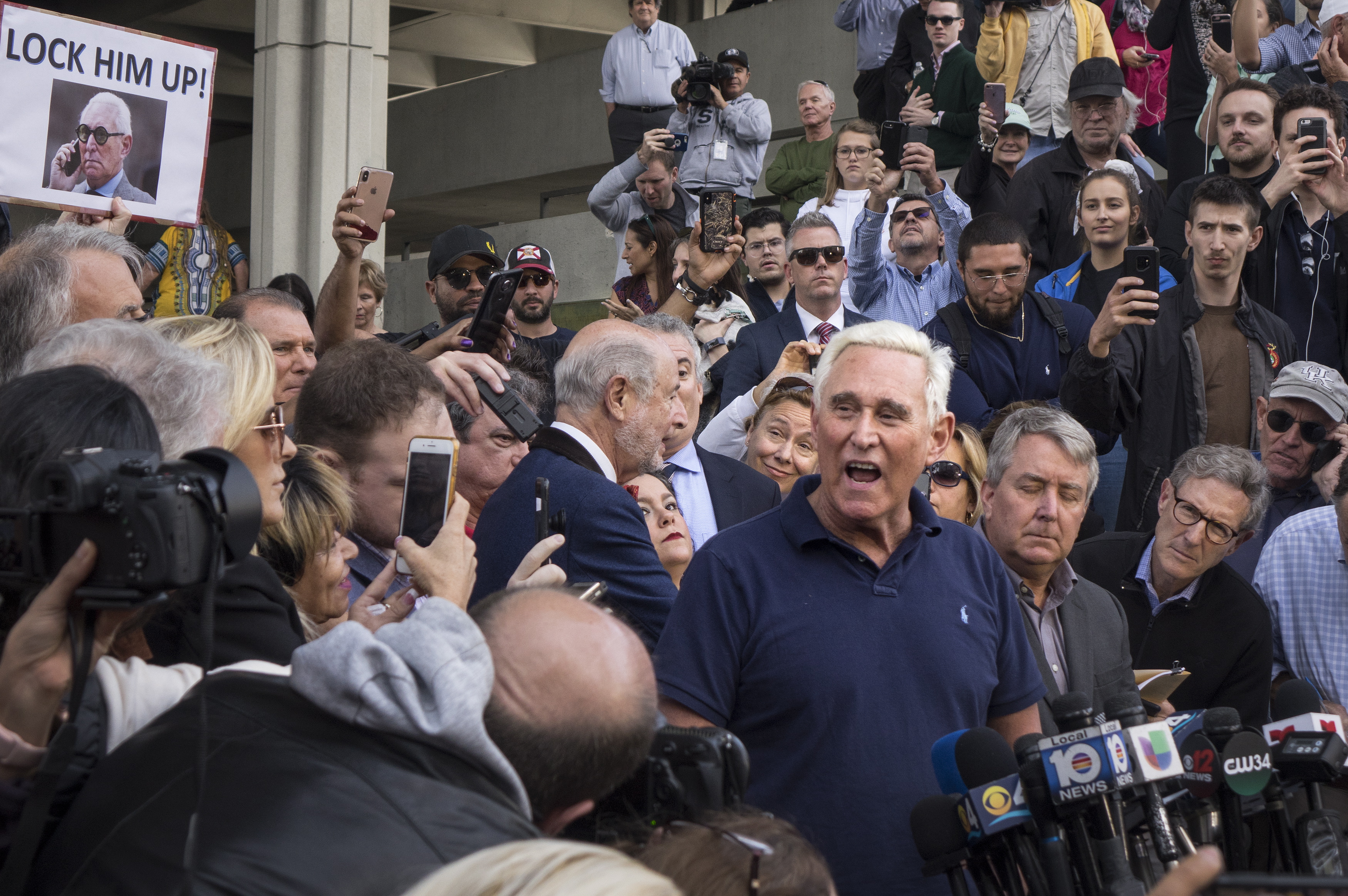 epa07319271 Roger Stone (C) speaks with the media outside the US Federal Building and Courthouse in Fort Lauderdale, Florida, USA 25 January 2019. The American political consultant, lobbyist and strategist Roger Stone of Fort Lauderdale, Florida, was arrested in Fort Lauderdale today following an indictment by a federal grand jury on 24 January 2019, in the District of Columbia. The indictment, which was unsealed upon arrest, contains seven counts: one count of obstruction of an official proceeding, five counts of false statements, and one count of witness tampering. Stone will make an initial appearance today before U.S. Magistrate Judge Lurana S. Snow.  EPA/CRISTOBAL HERRERA