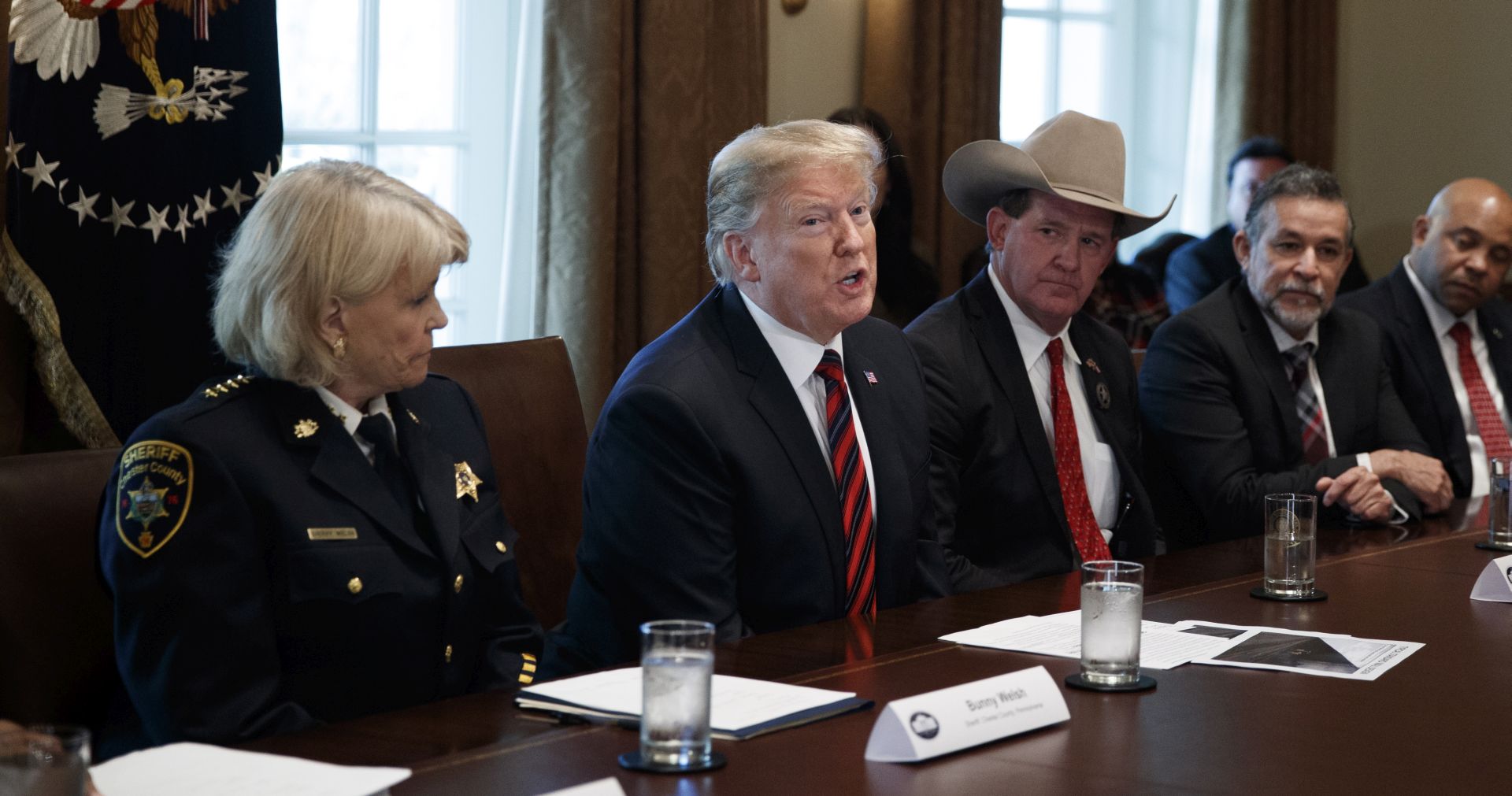 epa07276203 US President Donald J. Trump (2-L) participates in a roundtable discussion on border security and safe communities with State, local and community leaders in the Cabinet Room of the White House in Washington, DC, USA 11 January 2019. Picture with Trump are among others Chester County Sheriff Carolyn Bunny Welsh (L) and Jackson County Sheriff AJ Louderback (3-L). Te partial government shutdown, which is tied for the longest in US history, has affected about 800,000 federal workers.  EPA/SHAWN THEW