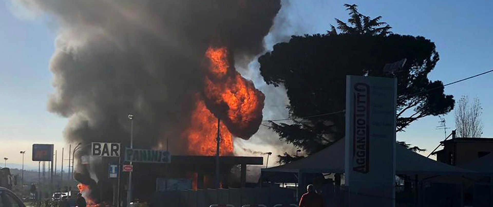 epa07210287 A view of a column of smoke following an explosion that occurred at a petrol station in Borgo Quinzio, near Rieti, central Italy, 05 December 2018. Two people were killed and about a dozen of others were injured after an explosion at a petrol station in the central province of Rieti, police sources said. The two victims were a firefighter and a person who was near the station when a liquefied petroleum gas tanker reportedly exploded, media said.  EPA/EMILIANO GRILLOTTI