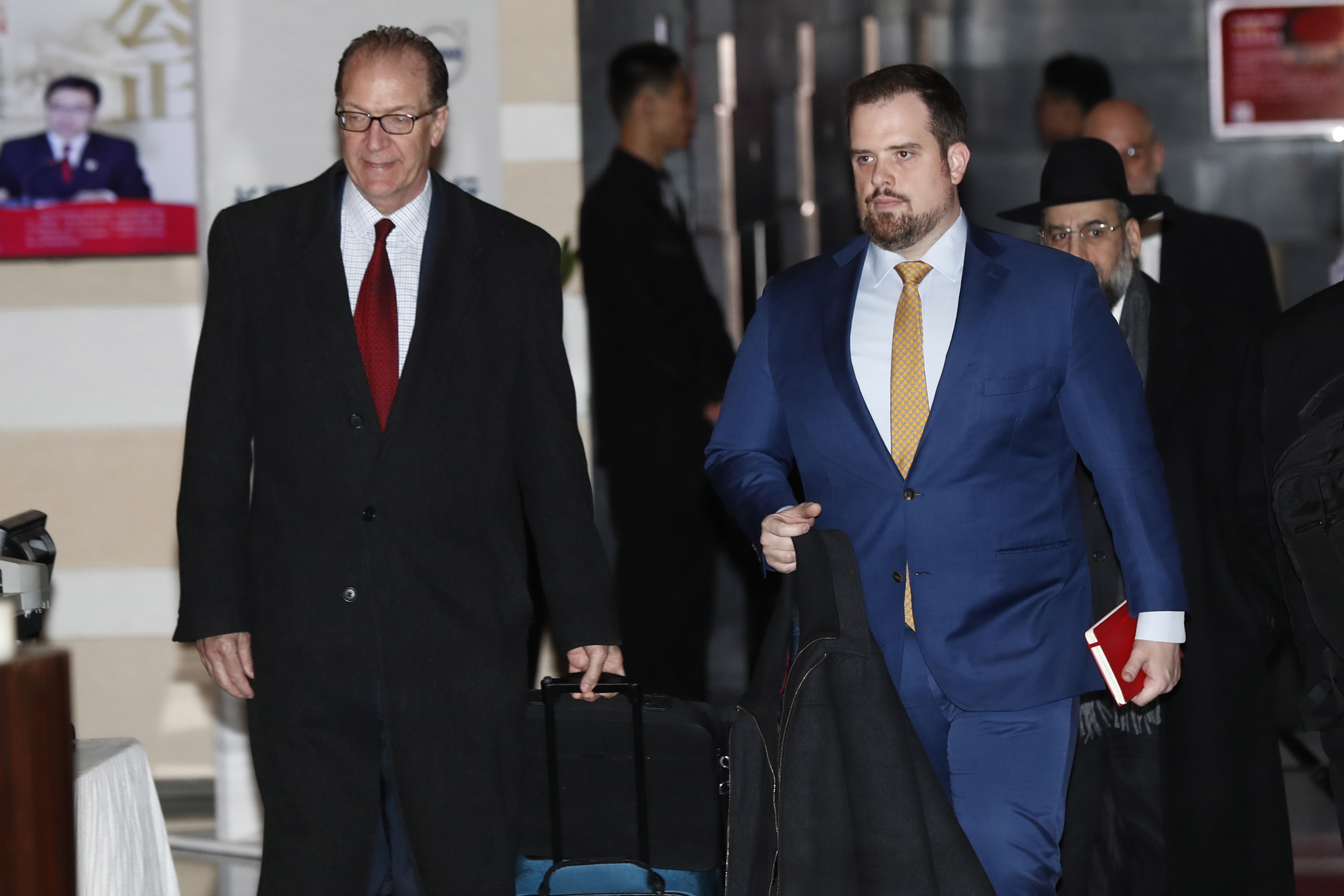 epa07268551 US Undersecretary for International Affairs David Malpass (L) walks with others delegates as they leave the Westin Hotel in Beijing, China, 08 January 2019. The US delegation arrived in Beijing for the start of two-day trade talks between China and US.  EPA/WU HONG