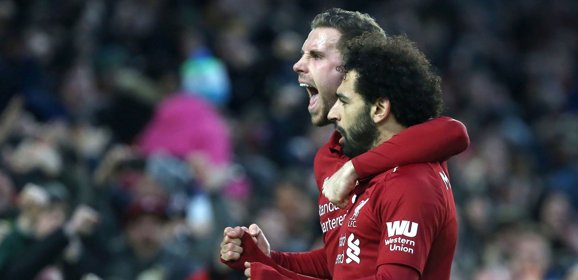 epa07278065 Liverpool's Mohamed Salah celebrates scoring the opening goal with  teammate Jordan Henderson during the English Premier League soccer match between Brighton Hove Albion and Liverpool at the Amex Stadium in Brighton, Britain, 12 January 2019.  EPA/James Boardman EDITORIAL USE ONLY. No use with unauthorized audio, video, data, fixture lists, club/league logos or 'live' services. Online in-match use limited to 120 images, no video emulation. No use in betting, games or single club/league/player publications
