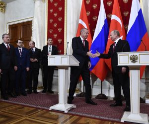 epa07312927 Russian President Vladimir Putin (R) and Turkish President Recep Tayyip Erdogan (2-R) shake hands at the end of a joint press conference following their talks at the Kremlin in Moscow, Russia, 23 January 2019. Turkish President  is on a working visit in Moscow to discuss with Russian counterpart the settlement process in Syria as well as various issues of bilateral cooperation.  EPA/ALEXANDER NEMENOV / POOL