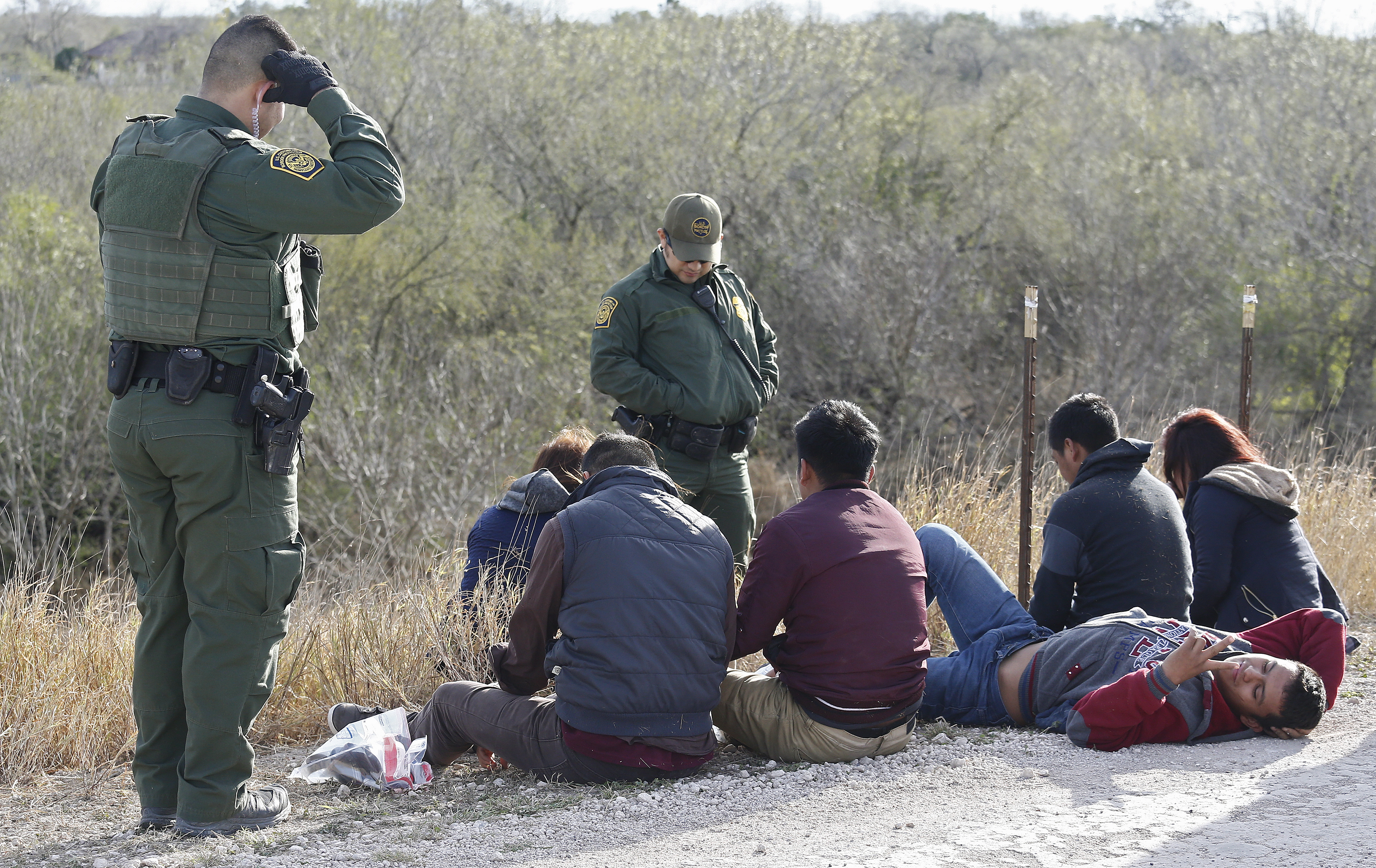 epa07313163 United States Border Patrol agents process people suspected of crossing the Rio Grande River to enter the United States illegally near McAllen, Texas, USA, 23 January 2019. The nearly two thousand mile United States Mexico border is the most frequently crossed international border in the world. According to reports, the nearly two thousand mile United States Mexico border is the most frequently crossed international border in the world.  EPA/LARRY W. SMITH