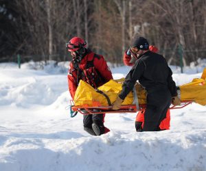 epa07331358 Medics transport an injured person to a helicopters of TOPR (Tatra Volunteer Rescue Service) which is flying to the hospital in Zakopane, Poland, 30 January 2019. Five people were injured after being hit by an avalanche, which descended from Rysy near Morskie Oko in the Tatra Mountains, on 30 January 2019. In the Tatras there is a moderate degree of avalanche danger.  EPA/Grzegorz Momot POLAND OUT