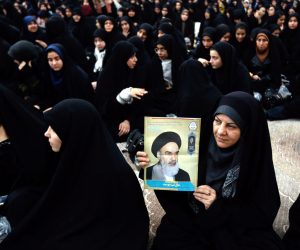 epa07335710 An Iranian woman holds a poster of Iran's late founder of the Islamic Republic, Ayatollah Ruhollah Khomeini on the occasion of the 40th anniversary of Khomeini's return from exile from Paris, at his mausoleum in southern Tehran, Iran, 01 February 2019. Iran will celebrate its 40th revolution anniversary on 11 February 2019.  EPA/ABEDIN TAHERKENAREH