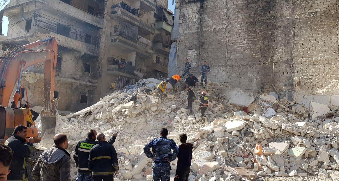 epa07337713 A handout photo released by Syria's Arab News Agency SANA shows a collapsed building in the northern city of Aleppo, Syria, 02 February 2019. According to Sana, 11 people were killed when a five-story building collapsed in Saladin neighborhood in Aleppo. Another man was rescued from underneath the rubble. Sana added that the building located in a damaged area that was repeatedly hit by terrorist attacks, raising the likelihood that the building might be cracked.  EPA/SANA HANDOUT  HANDOUT EDITORIAL USE ONLY/NO SALES HANDOUT EDITORIAL USE ONLY/NO SALES