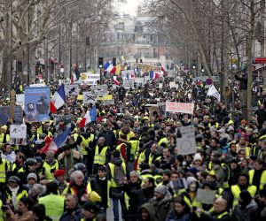 epa07337962 Protesters from the 'Gilets Jaunes' (Yellow Vests) movement take part in the 'Act XII' demonstration (the 12th consecutive national protest on a Saturday) in Paris, France, 02 February 2019. The so-called 'gilets jaunes' (yellow vests) is a grassroots protest movement with supporters from a wide span of the political spectrum, that originally started with protest across the nation in late 2018 against high fuel prices. The movement in the meantime also protests the French government's tax reforms, the increasing costs of living and some even call for the resignation of French President Emmanuel Macron.  EPA/YOAN VALAT