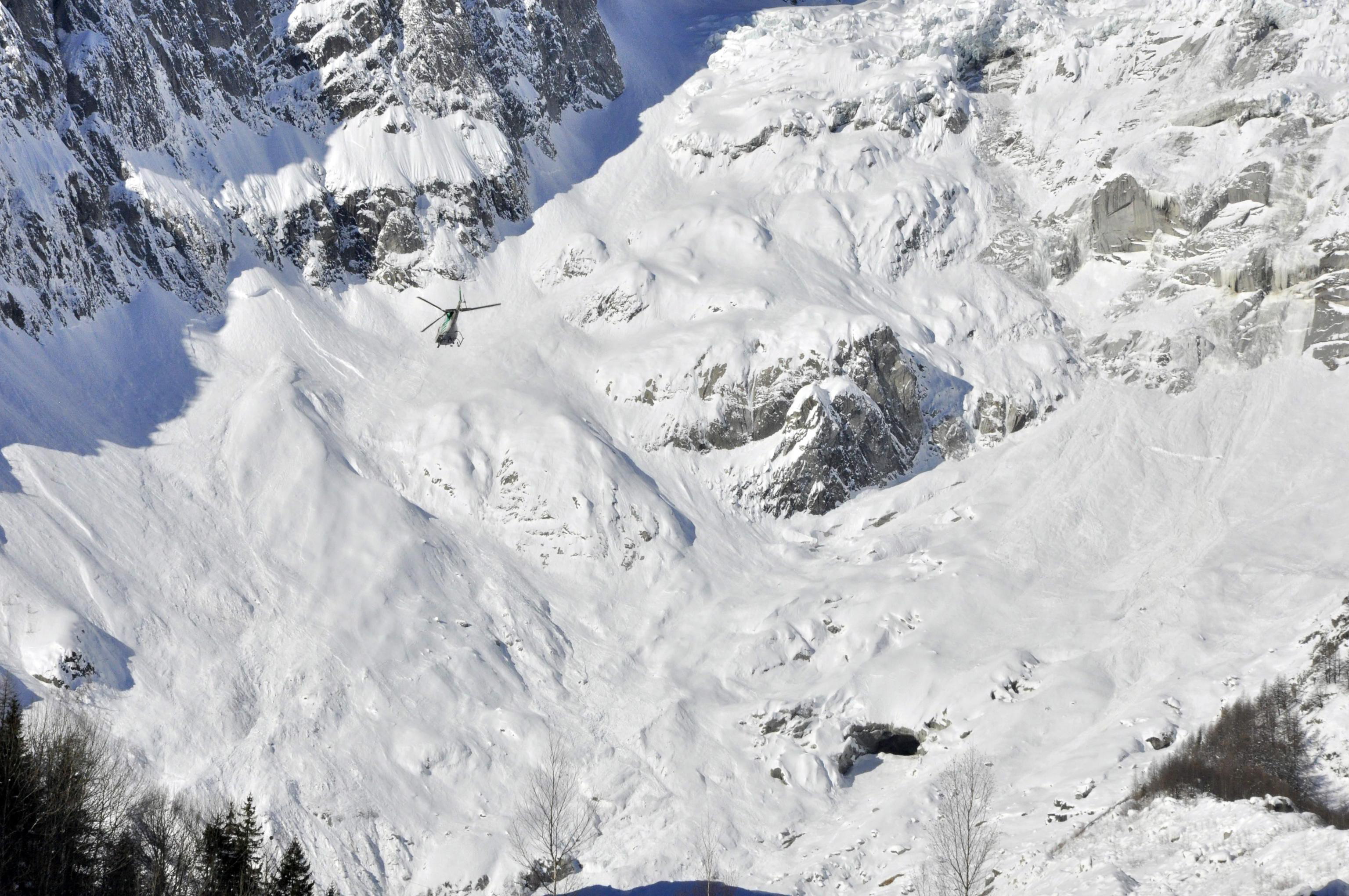 epa07342657 Recovery operations underway for the bodies of three free riders killed in an avalanche in Val Veny, identified as two British and a French, near the Alpine resort of Courmayeur, northwest Italy, 04 February 2019. The bodies of three people were found under an avalanche in the Canale degli Spagnoli, in Val Veny. Two British and two French skiers were reported missing on 03 February afternoon as high risk for avalanches was reported in the area. Searchers were said to be looking for the missing fourth skier.  EPA/THIERRY PRONESTI