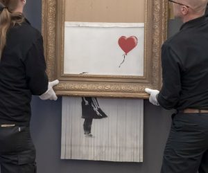 epa07342914 Museum employees hang Banksy's 'Love is in the Bin' artwork at the Frieder Burda Museum in Baden-Baden., Germany, 04 February 2019. The Frieder Burda Museum will be showing from 05 February 2019 to 03 March 2019 to the public for the first time the Banksy work 'Love is in the Bin', acquired by a European collector and auctioned off at Sotheby's in London.  EPA/RONALD WITTEK