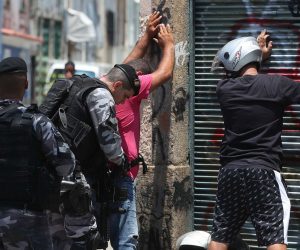 epa07353460 Agents of the Operations Command of the police carry out an operation, in Rio de Janeiro, Brazil, 08 February 2019. At least 13 people died on the same day during a shootout in several favelas in downtown Rio de Janeiro, the most emblematic city of Brazil which is experiencing a wave of violence since mid 2016, according to official sources. The victims died during clashes with agents of the Police Operations Command in the framework of an operation against drug trafficking in the region, in which various criminal organizations dispute control.  EPA/MARCELO SAYAO