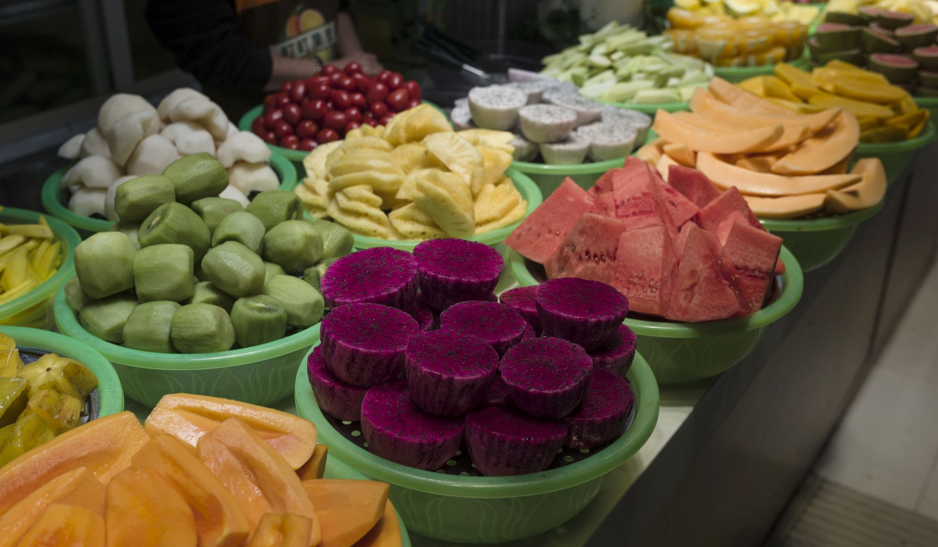 epa07357501 Cut fruits are on sale at a stall in a street food market in the Dongmen area of Shenzhen, Guangdong Province, China, 09 February 2019 (issued 10 February 2019). Dongmen is a shopping area and subdistrict within Luohu District and one of the oldest part of the city. The street food market is popular with locals and visitors alike.  EPA/STR