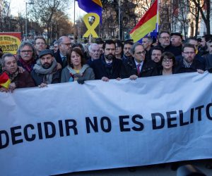 epa07363544 Catalan regional President Quim Torra (5-R) and the Speaker of the Catalan Parliament Roger Torrent (6-L) help holding a banner reading 'Is not a crime to decide' as they arrive to the Supreme Court in Madrid, Spain, 12 February 2019, to attend the so-called 'process' trial against 12 Catalan pro-independence politicians involved in the illegal referendum held back in 2017. The trial against the Catalan politicians involved in the illegal pro-independence referendum kicks off in the Spanish capital with nine of the 12 pro-independence leaders accused of rebellion and embezzlement for their role in the Catalan illegal independence referendum back in 2017, while the other three accused face disobedience charges. More than 500 people have been called to declare, some of them former members of the Spanish Government such as former Primer Minister Mariano Rajoy. Others are not identified.  EPA/RODRIGO JIMENEZ