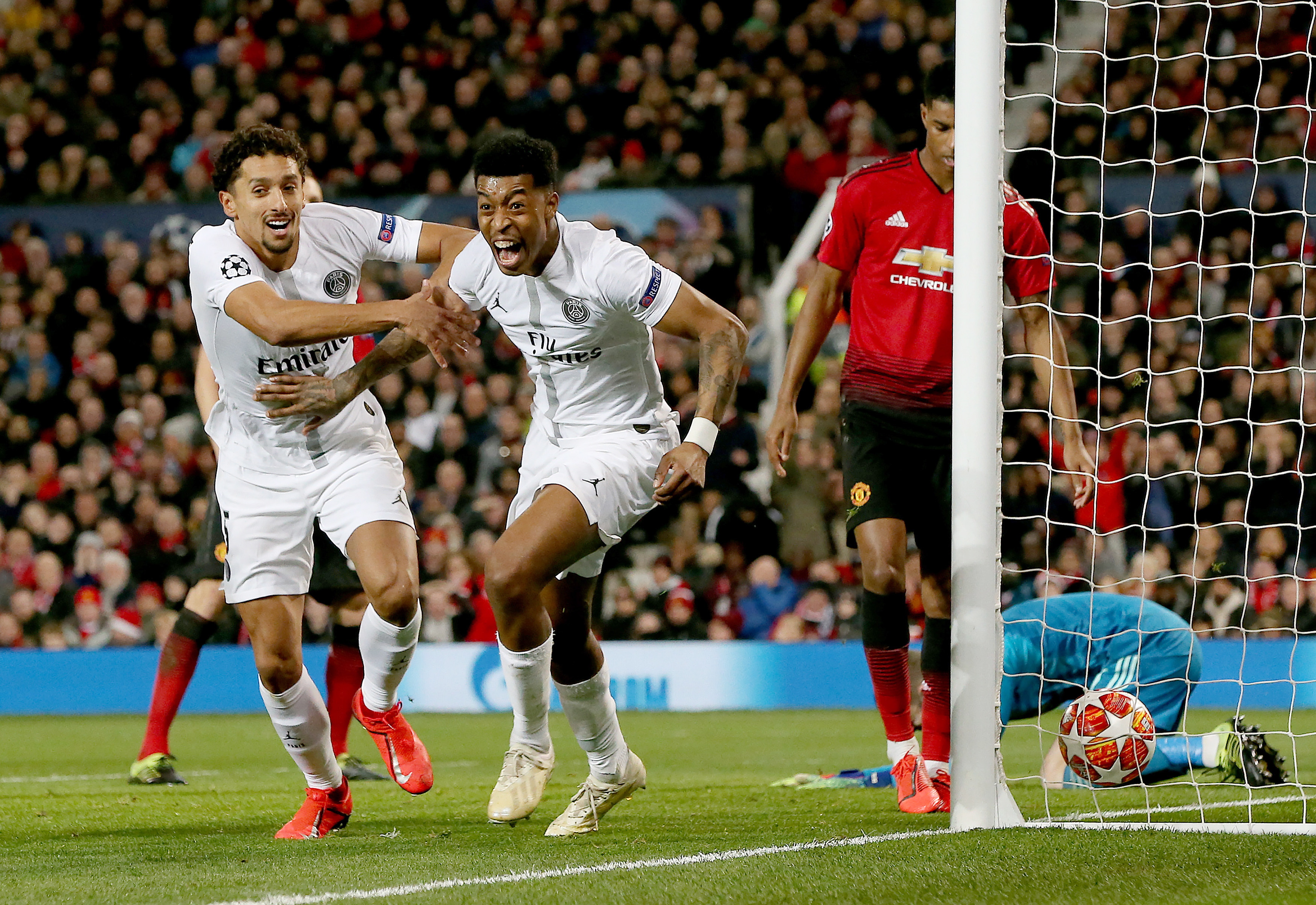 epa07365544 Paris Saint Germain's Presnel Kimpembe (C) celebrates scoring the 1-0 lead during the UEFA Champions League round of 16 first leg soccer match between Manchester United and Paris Saint Germain at Old Trafford Stadium in Manchester, Britain, 12 February 2019.  EPA/NIGEL RODDIS