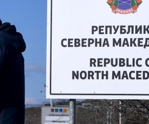 epa07366637 A man passes the new country name North Macedonia sign board, at the border crossing Bogorodica between North Macedonia and Greece on 13 February 2019. FYR of Macedonia Government is due change the name of country after ratification of the Protocol of the North Atlantic Treaty for the Accession of Republic of North Macedonia whereby Greece will approve the accession of its northern neighbor to NATO under its new name, as provided by the Prespes Agreement signed by Athens and Skopje.  EPA/GEORGI LICOVSKI