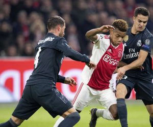epa07367856 David Neres (C) of Ajax Amsterdam in action with Real Madrids Sergio Ramos (L) and Sergio Reguilon during the UEFA Champions League round of 16 first leg soccer match between Ajax Amsterdam and Real Madrid in AMsterdam, Netherlands,  13 February 2019.  EPA/OLAF KRAAK