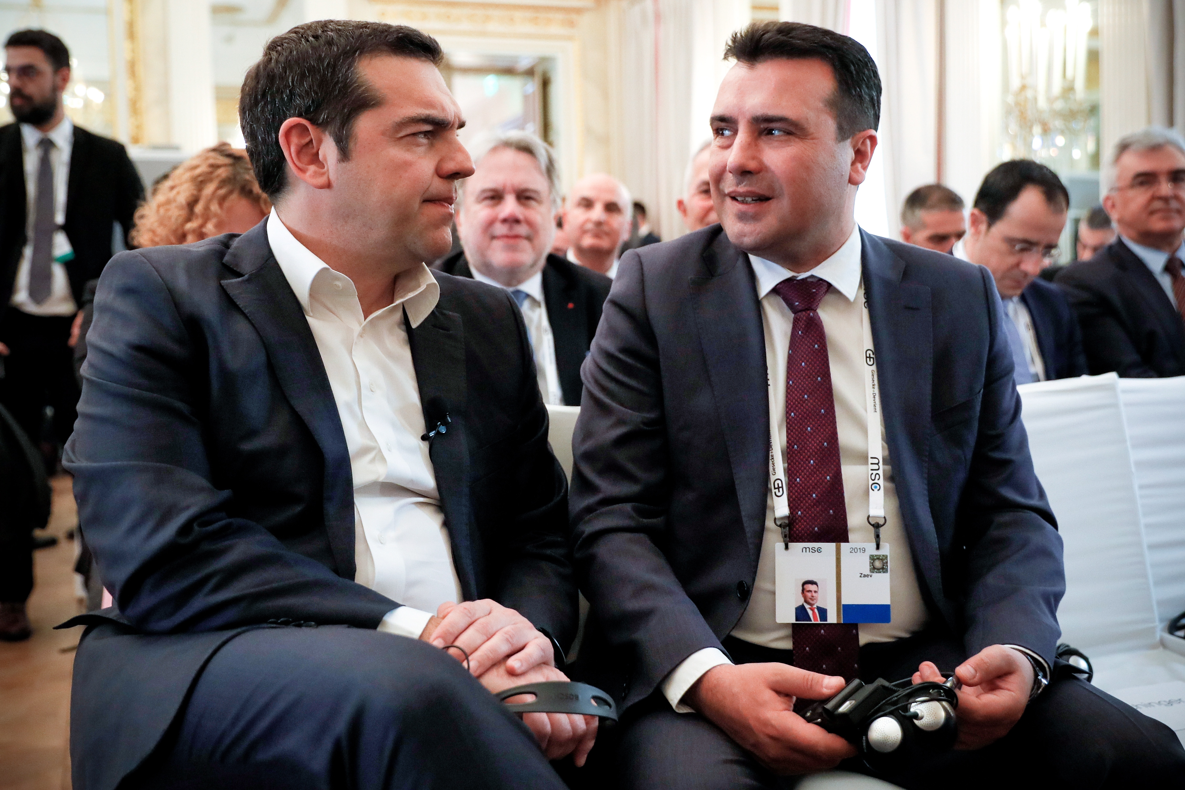 epa07374649 Greek Prime Minister Alexis Tsipras (L) and North Macedonian Prime Minister Zoran Zaev (R) attend a discussion session during the 55th Munich Security Conference (MSC) in Munich, Germany, 16 February 2019. From 15 to 17 February, politicians, various experts and guests from all over the world will discuss global security issues in their annual meeting.  EPA/RONALD WITTEK
