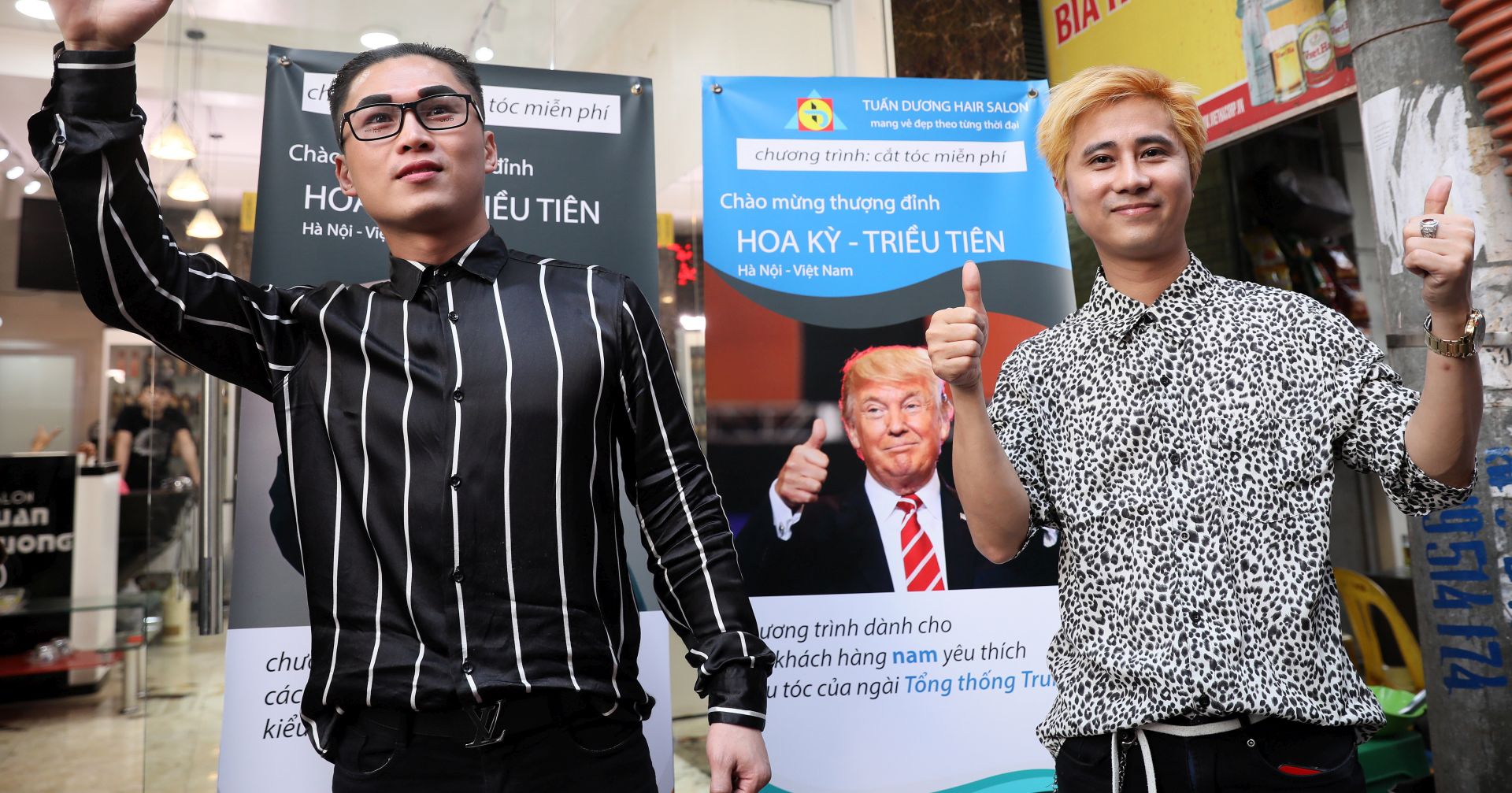 epa07383019 Two customers pose for a photo after having North Korean leader Kim Jong-un and US President Donald Trump haircuts style at a salon in Hanoi, Vietnam, 20 February 2019. Le Tuan Duong, the owner of a salon, has offered free Trump or Kim Jong-un hairstyles to any customer, a week before the two leader's second summit which will take place in Hanoi from 27 to 28 February 2019.  EPA/LUONG THAI LINH