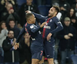 epa07383878 Paris Saint Germain's Layvin Kurzawa (R) reacts with Paris Saint Germain's Kylian Mbappe (L) after scoring the 1-0 lead during the French Ligue 1 soccer match between PSG and Montpellier at the Parc des Princes stadium in Paris, France, 20 February 2019.  EPA/YOAN VALAT
