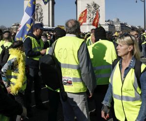 epa07389890 Protesters from the 'Gilets Jaunes' (Yellow Vests) movement gather at the Champs Elysees as they take part in the 'Act XV' demonstration (the 15th consecutive national protest on a Saturday) in Paris, France, 23 February 2019. The so-called 'gilets jaunes' (yellow vests) is a grassroots protest movement with supporters from a wide span of the political spectrum, that originally started with protest across the nation in late 2018 against high fuel prices. The movement in the meantime also protests the French government's tax reforms, the increasing costs of living and some even call for the resignation of French President Emmanuel Macron.  EPA/YOAN VALAT