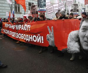 epa07392031 Opposition supporters take part in a memorial march for Boris Nemtsov to mark the fourth anniversary of his murder, in Moscow, Russia, 24 February 2019. Boris Nemtsov, a liberal opposition leader and sharp critic of Russian president Vladimir Putin, was killed on 27 February 2015 by a group of Chechen military servicemen. Five were arrested, one was killed during detention, and one of the organizers of the crime is still wanted.  EPA/MAXIM SHIPENKOV