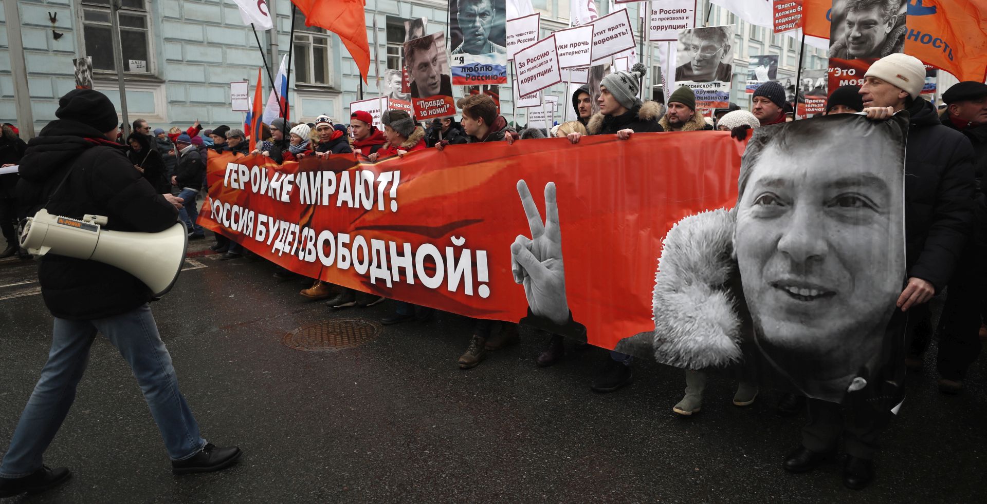 epa07392031 Opposition supporters take part in a memorial march for Boris Nemtsov to mark the fourth anniversary of his murder, in Moscow, Russia, 24 February 2019. Boris Nemtsov, a liberal opposition leader and sharp critic of Russian president Vladimir Putin, was killed on 27 February 2015 by a group of Chechen military servicemen. Five were arrested, one was killed during detention, and one of the organizers of the crime is still wanted.  EPA/MAXIM SHIPENKOV
