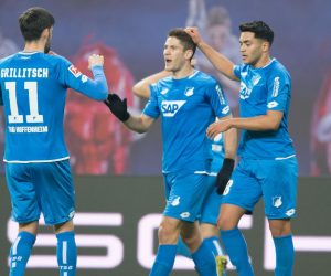 25 February 2019, Leipzig: Hoffenheim's Andrej Kramaric (C) celebrates scoring his side's first goal with teammates Florian Grillitsch (L) and Nadiem Amiri (R) during the German Bundesliga soccer match between RB Leipzig and 1899 Hoffenheim in the Red Bull Arena Leipzig. Photo: Sebastian Kahnert/dpa-Zentralbild/dpa - IMPORTANT NOTE: In accordance with the requirements of the DFL Deutsche Fußball Liga or the DFB Deutscher Fußball-Bund, it is prohibited to use or have used photographs taken in the stadium and/or the match in the form of sequence images and/or video-like photo sequences.