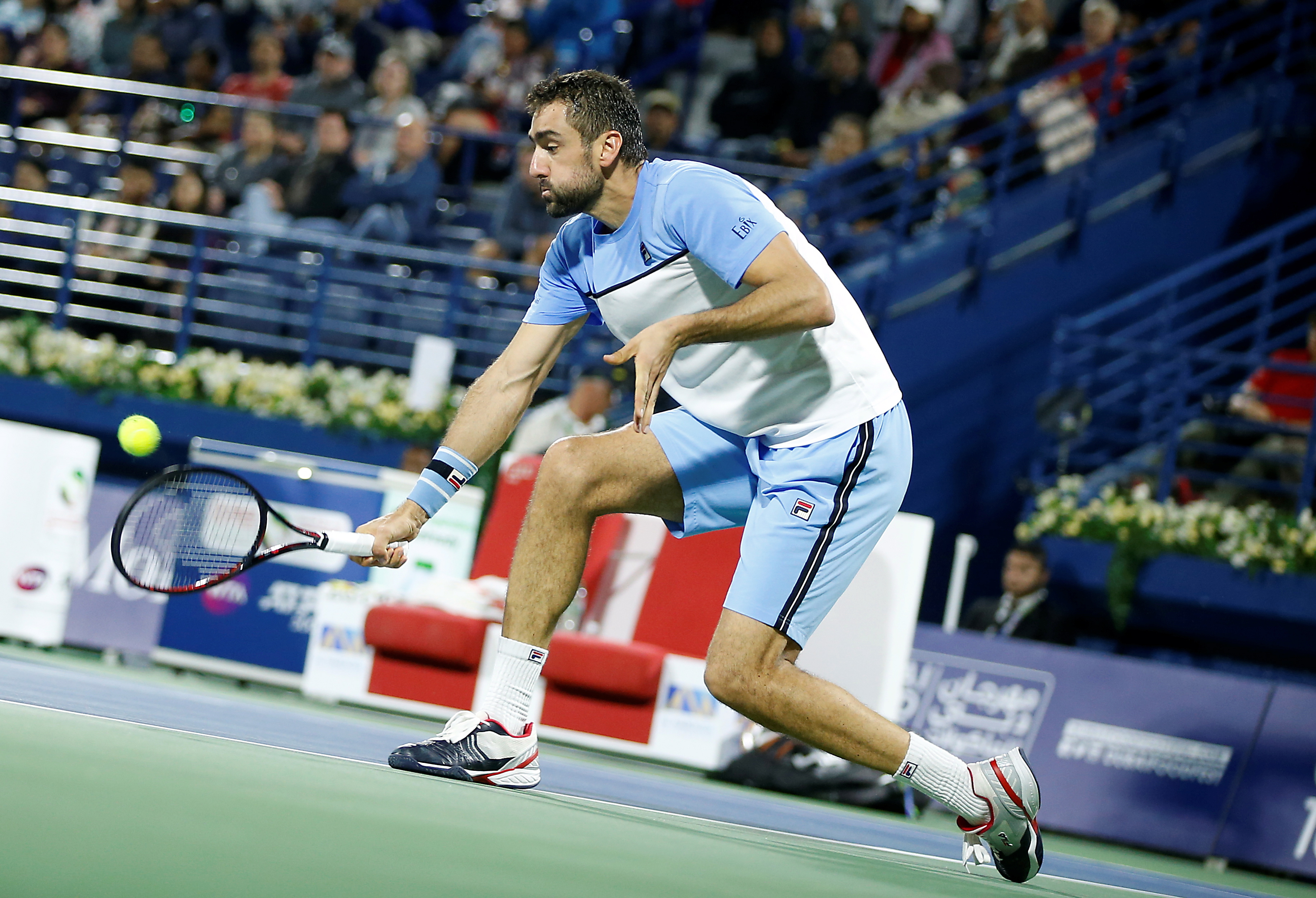 epa07399242 Marin Cilic of Croatia in action during his first round match against Gael Monfils of France at the Dubai Duty Free Tennis ATP Championships 2019 in Dubai, United Arab Emirates, 26 February 2019.  EPA/ALI HAIDER